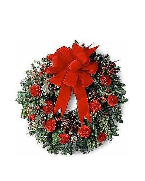 Crimson &amp; Evergreen Wreath - A Christmas wreath is a traditional gift of cheer in the holiday season. This beautiful wreath with a bright red bow is decorated with red carnations, winterberries, pine cones and more. A great gift idea for friends, family or business associates.