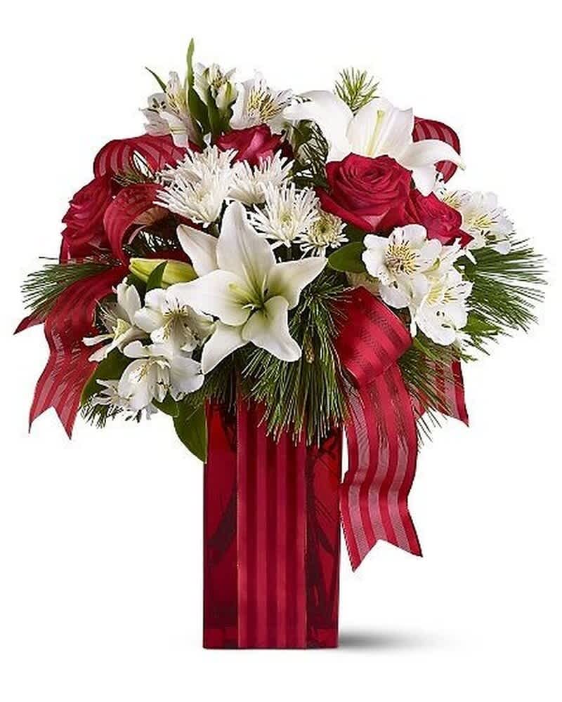 Tall red vase arrangement with red roses, white lilies, white mums, pine, and a red striped ribbon