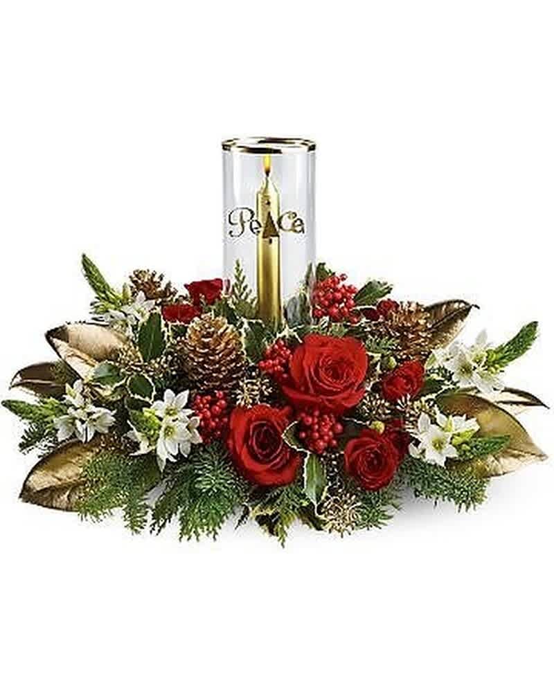 Holiday centerpiece with red roses, white flowers, pinecones and a gold candle in a glass holder
