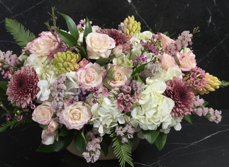 DESIGNERS CHOICE PASTEL SPRING BASKET - Our designers will choose the nicest , freshest flowers to design a perfect gift.