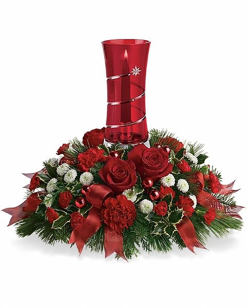Star Bright Centerpiece - Bring star power to the table this year with a lush holiday centerpiece cradling a ruby red glass hurricane lamp decorated with a shooting star. Light the candle of this Christmas centerpiece and watch your guests' eyes light up. This year, next year, and for many holidays to come. The festive Christmas floral centerpiece includes red roses, red carnations, red miniature carnations, white button spray chrysanthemums, variegated holly, white pine, noble fir and cedar accented with red ribbon.