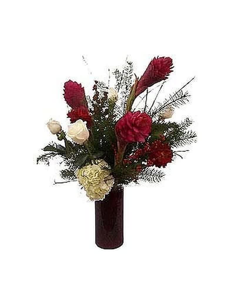 Tall red and white flower arrangement in a dark red cylinder vase