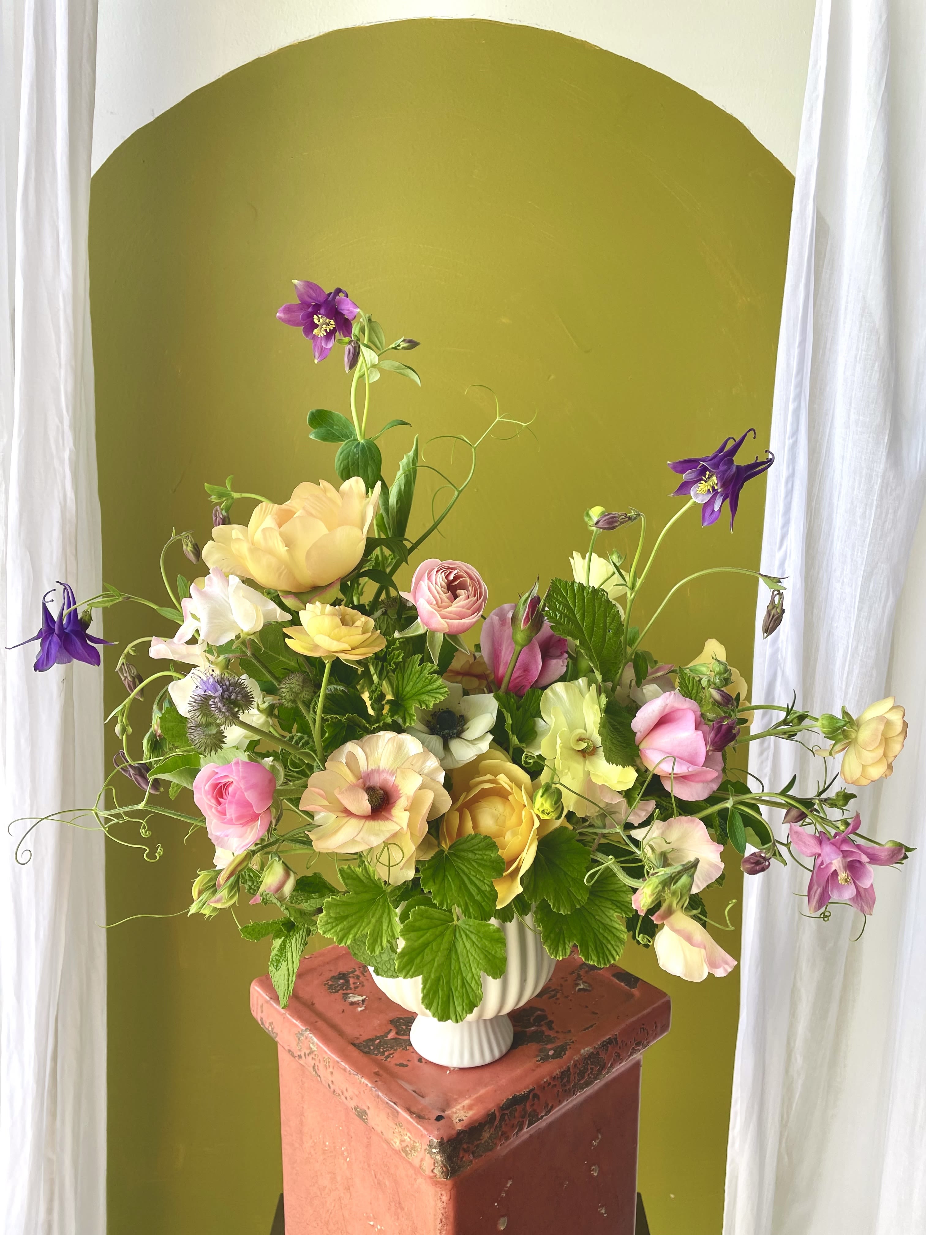 Fairy Garden  - The "Fairy Garden" arrangement is designed to capture the feeling of walking into your garden on a quiet afternoon, gathering blooms along the way.  Big, small, wild, but most of all playful.  This arrangement is perfect for someone who is in need of a pick me up, or someone who has a deep relationship with the magic in which a garden can provide.  Regardless, anyone will admire this arrangement for its variety of blooms, and its overall whimsy.   *Standard size pictured*  Concerning Seasonality: As a seasonal, locally-focused florist, we have different product to work with each week. Our focus is on creating a unique piece for each customer, with blooms that are fresh from local farms and growers. While the flower varieties and colors may vary, the quality and freshness will always be the best. It is an honor to have our customers' trust and confidence in our abilities and artistic eye.   Delivery Policy: Pick-ups at the studio are available after 2pm. Our daily delivery time frame is typically between 12- 3 PM. Please specify if you require a certain delivery time and we will do our best to accommodate it, or we will call you if we cannot. Please include any gate codes if applicable! If there is no answer at the door, our delivery person will leave the flowers by the doorstep in a weather safe location or contact you to reschedule the delivery.  Completing your order acknowledges that you have read and understand our delivery policies. 