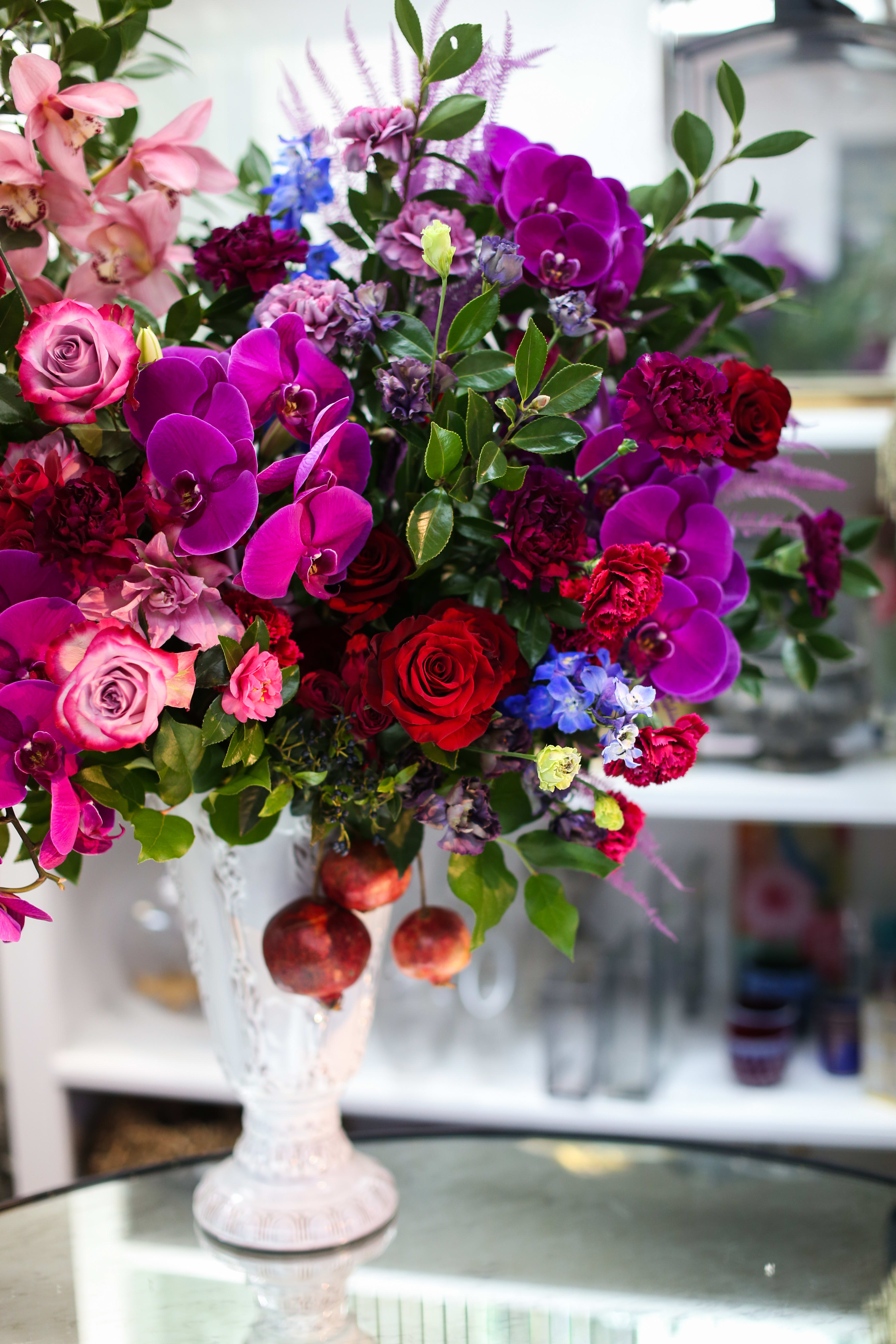 Bouquet of pink and purple flowers in a white vase