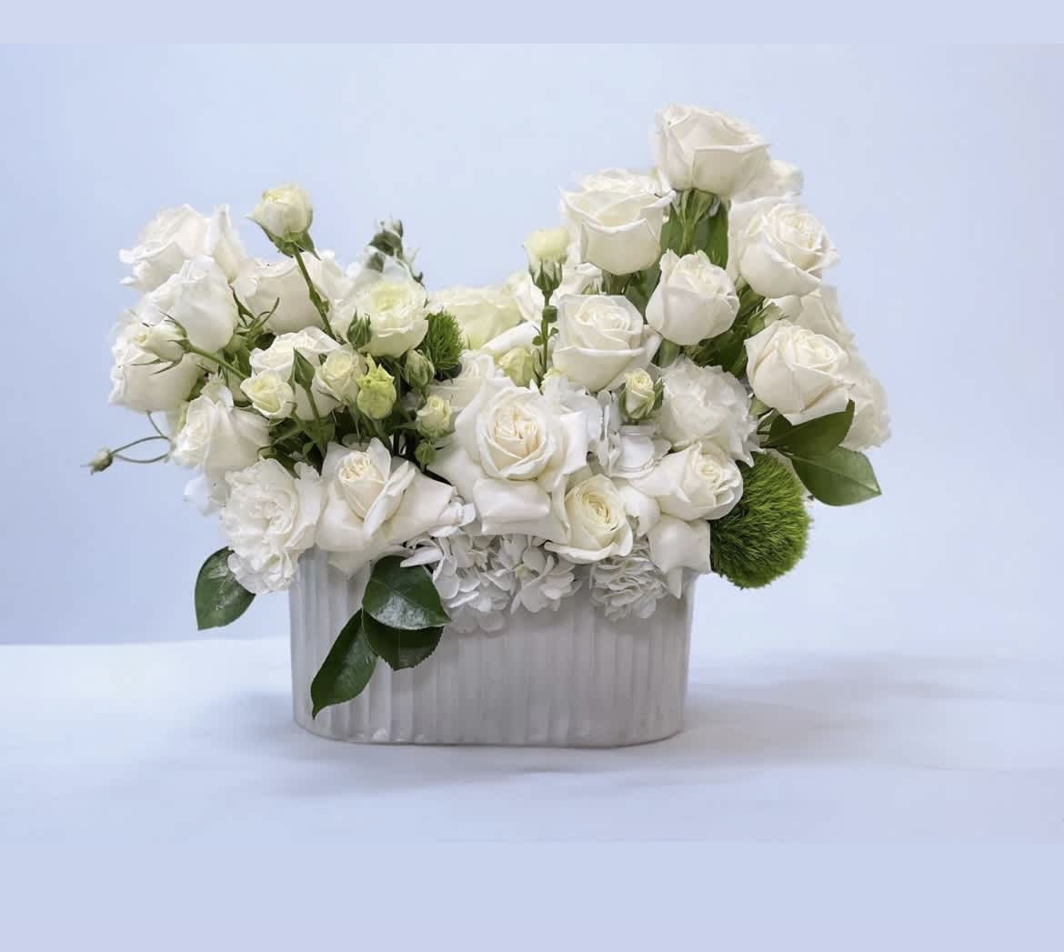 Pale Skies - White Roses, Spray Roses, and Lisianthus set in soft white Hydrangea and green Dianthus