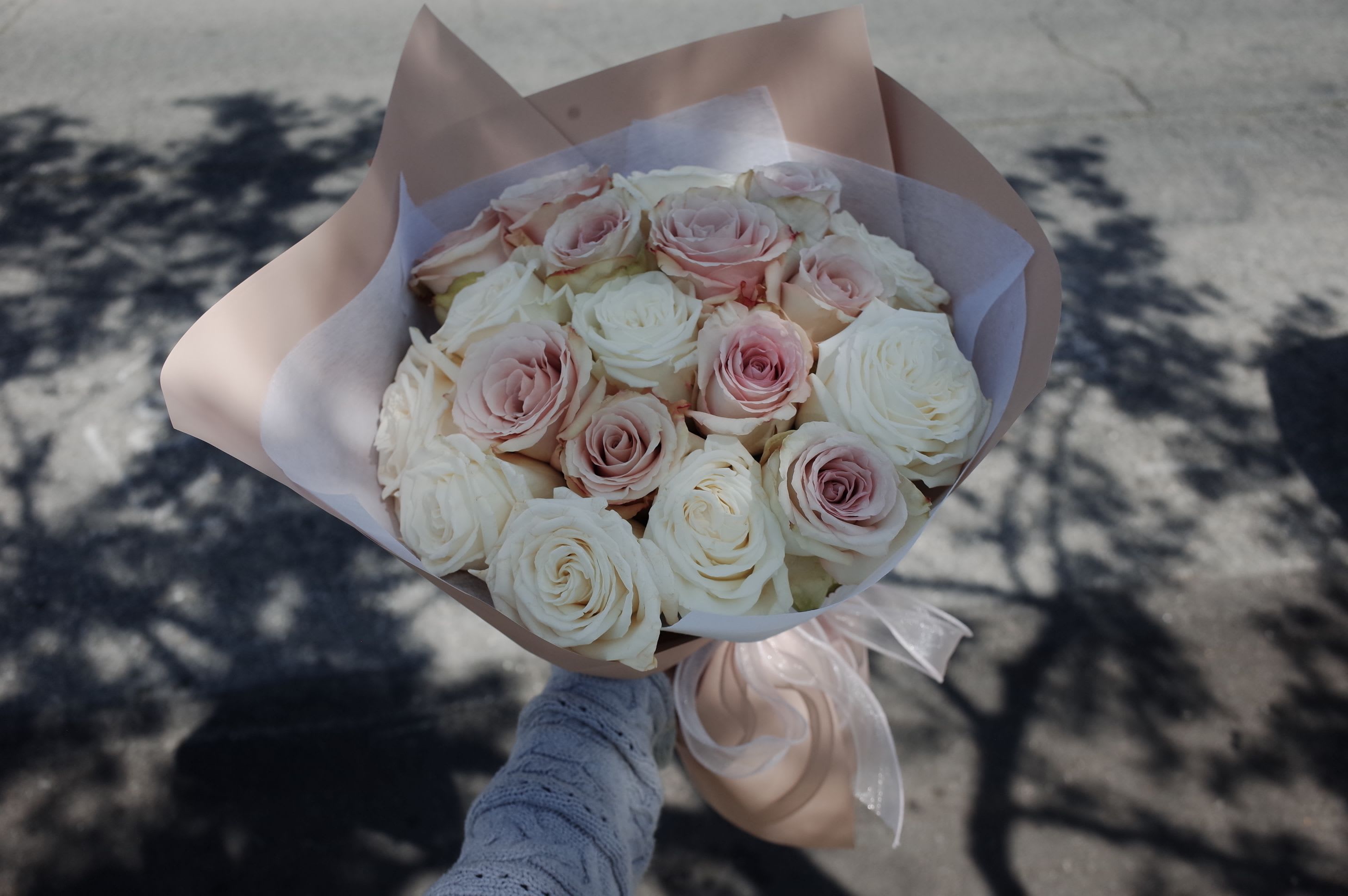 Quicksand Elegance - A soft, timeless bouquet featuring premium Quicksand roses in their signature champagne‑blush hue. With velvety petals and a naturally romantic shape, this arrangement brings effortless elegance to any moment — warm, neutral, and beautifully understated.