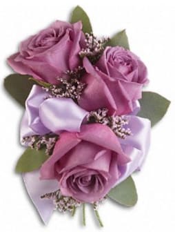 Lavender rose boutonniere with ribbon and small filler flowers
