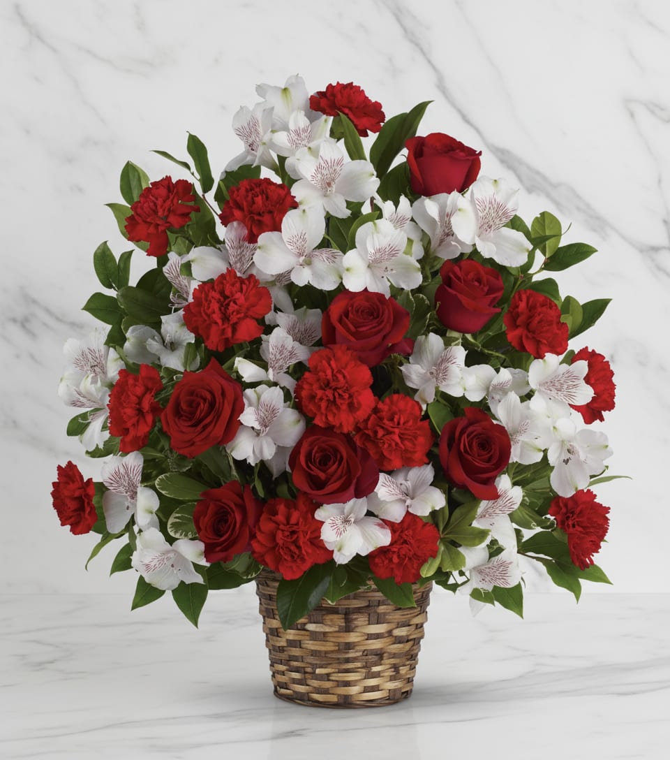 Truly Beloved Bouquet - Reach out to the family at home with this lovely array of classic blooms artistically arranged in a beautifully woven basket. They'll be deeply touched.