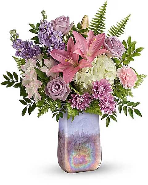 Glass Grandeur Bouquet - Breathtaking, hand-blown art glass vase, swirling with iridescence and bursting with a majestic array of hydrangea and roses. This grand arrangement features white hydrangea, lavender roses, pink asiatic lilies, pink alstroemeria, pink carnations, lavender stock, lavender cushion spray chrysanthemums, sword fern, huckleberry and leatherleaf fern. Delivered in Teleflora's Gemstone Art Glass Vase.  Standard 2 stock  1 hydrangea 2 lilies 3 roses 2 alstro 2 carnations
