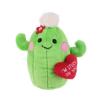 Stuck On You Cactus Plush by Ganz - A cuddly cactus plush that says "I'm Stuck On You" - perfect as a playful Valentine's Day or just-because gift to make someone smile. This green cactus-shaped plush has small raised arms, a cheerful embroidered face with pink cheek patches, and a bright red felt flower on top; the attached red heart pillow reads "I'M STUCK ON YOU" so the message is built right into the design for an immediate, charming moment.  Soft, huggable fabric and compact size make it ideal for a desk, bedside table, or to tuck into a larger gift box; the contrasting red, pink, and white accents give it a pop of color without being overly fussy. Choose this when you want to send a lighthearted, affectionate message - she'll feel noticed and amused, whether it's for Valentine's Day, a birthday, or just because.