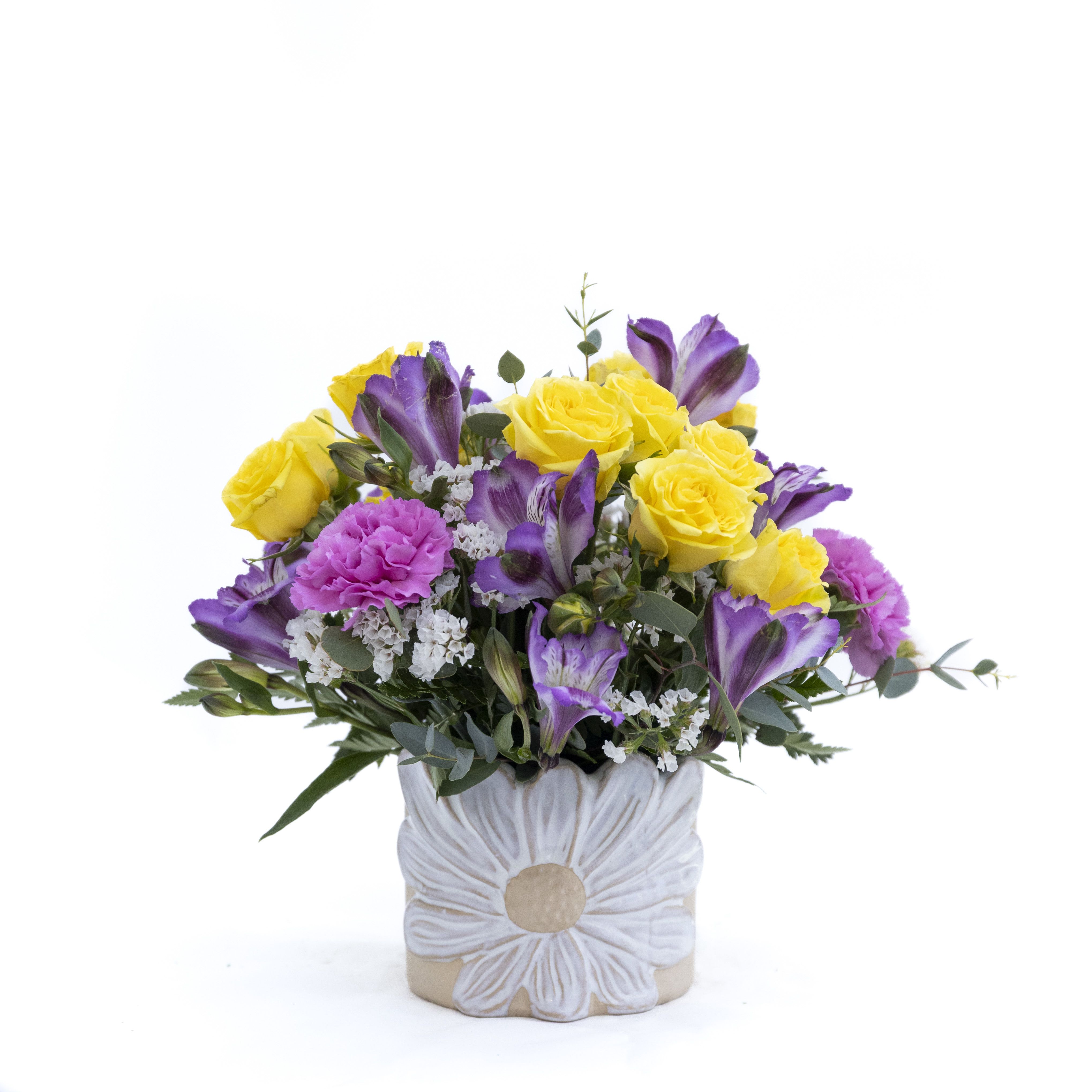 The Florence - Everyone will be fighting over this adorable ceramic daisy pot.  The vibrant yellow spray roses and purple alstroemeria feel bountiful in this daisy pot. Once you have enjoyed your flowers pot up a little container of your favorite herbs to continue the smiles. Delivery to Syracuse, North Syracuse, East Syracuse, Dewitt, Manlius, Jamesville, Fayetteville, Camillus, Marcellus, Minor, Mattydale, Liverpool