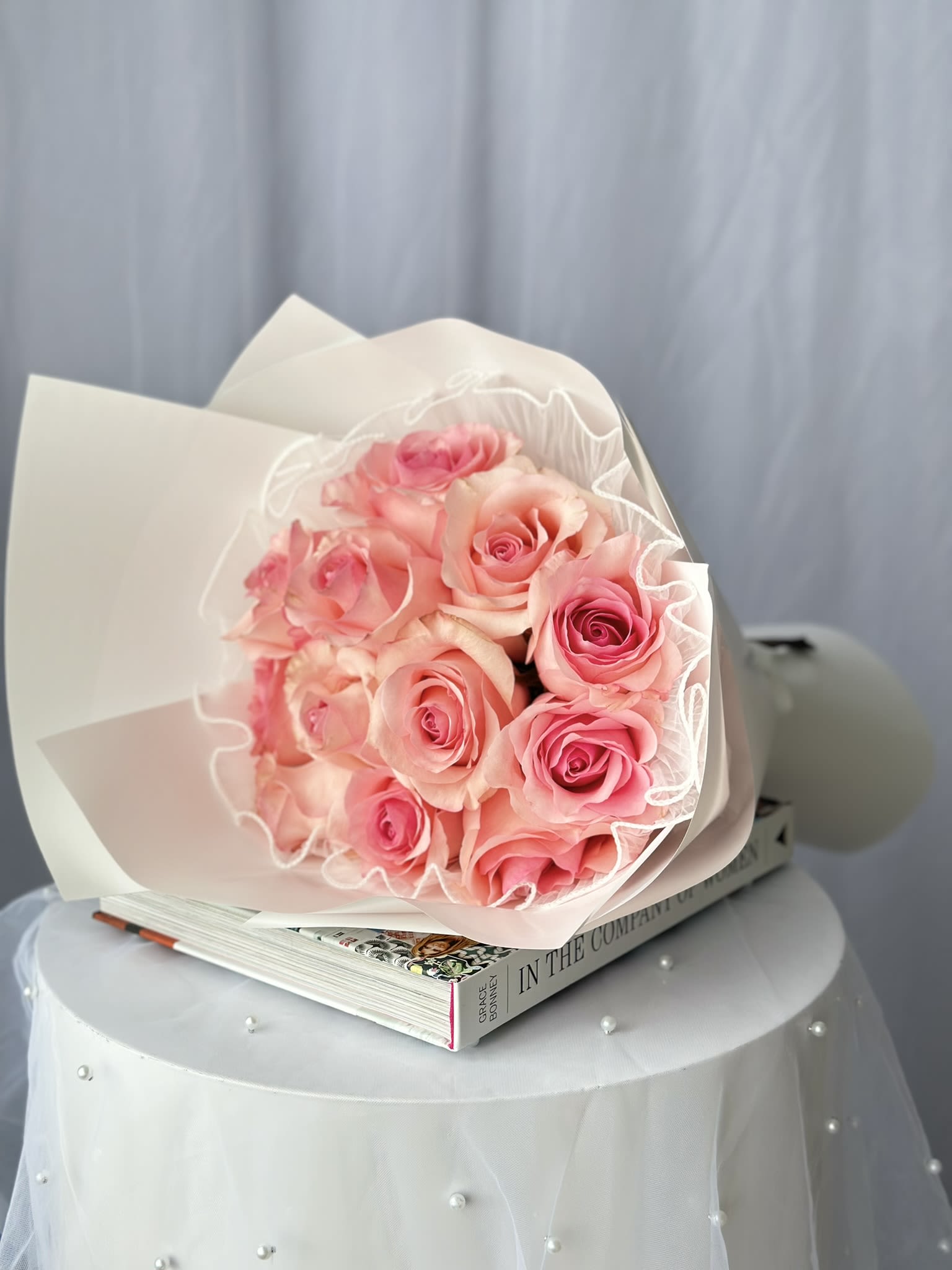 Eternal Romance pink (12 roses) - Introducing our Eternal Romance Bouquet, a luxurious arrangement designed to captivate and enchant. This exquisite bouquet features twelve fresh, velvety roses, each bloom symbolizing deep love and passion.  Whether for an Anniversary, Valentine's Day, or to say "I love you," the Eternal Romance Bouquet is perfect for expressing profound love and romance.