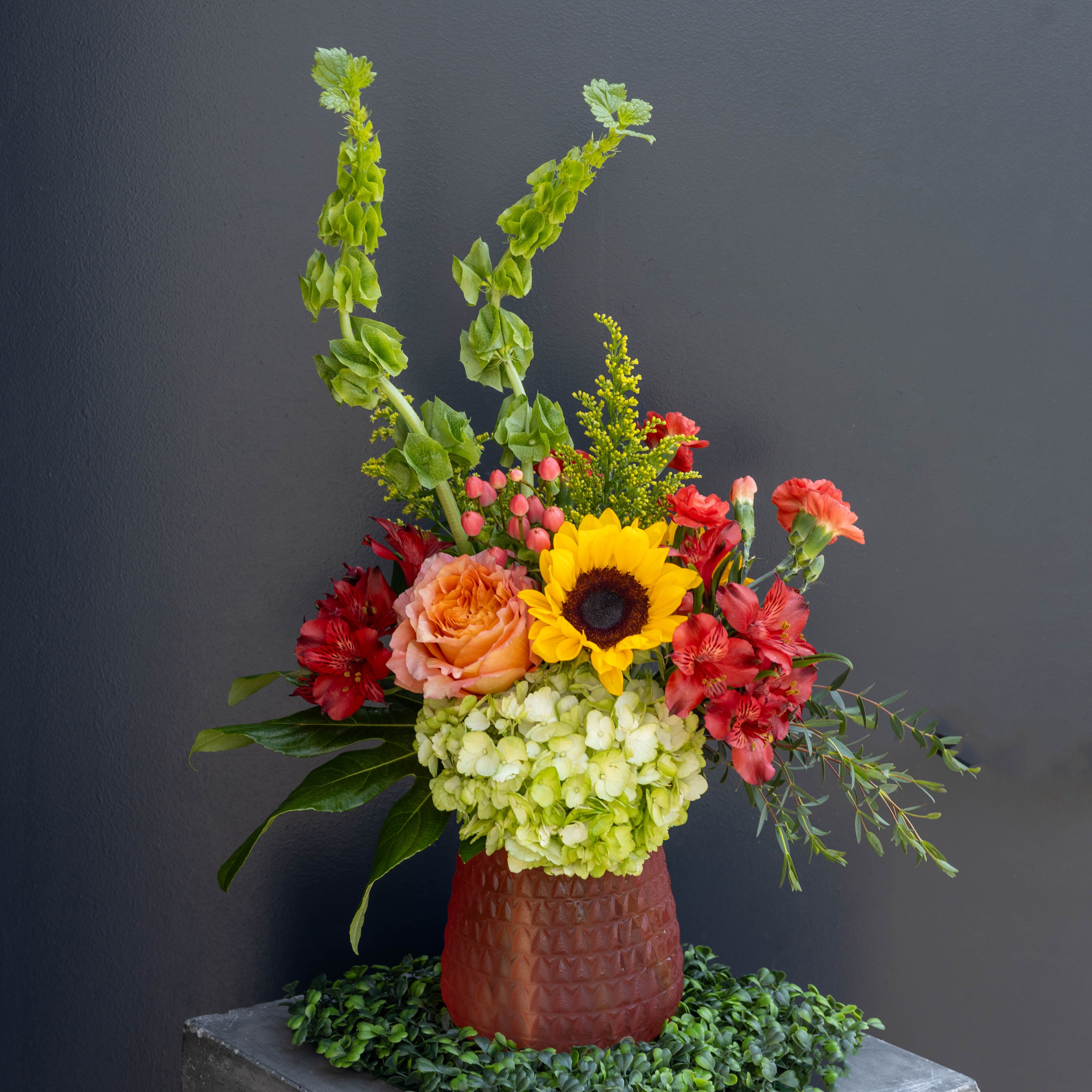 Spring Blush - Lush and layered, like a garden waking up, with warmth and color - the blushing of spring. The mix of coral, red, green, and that pop of sunflower gives it a slightly romantic, slightly wild spring vibe, perfect for any occasion!