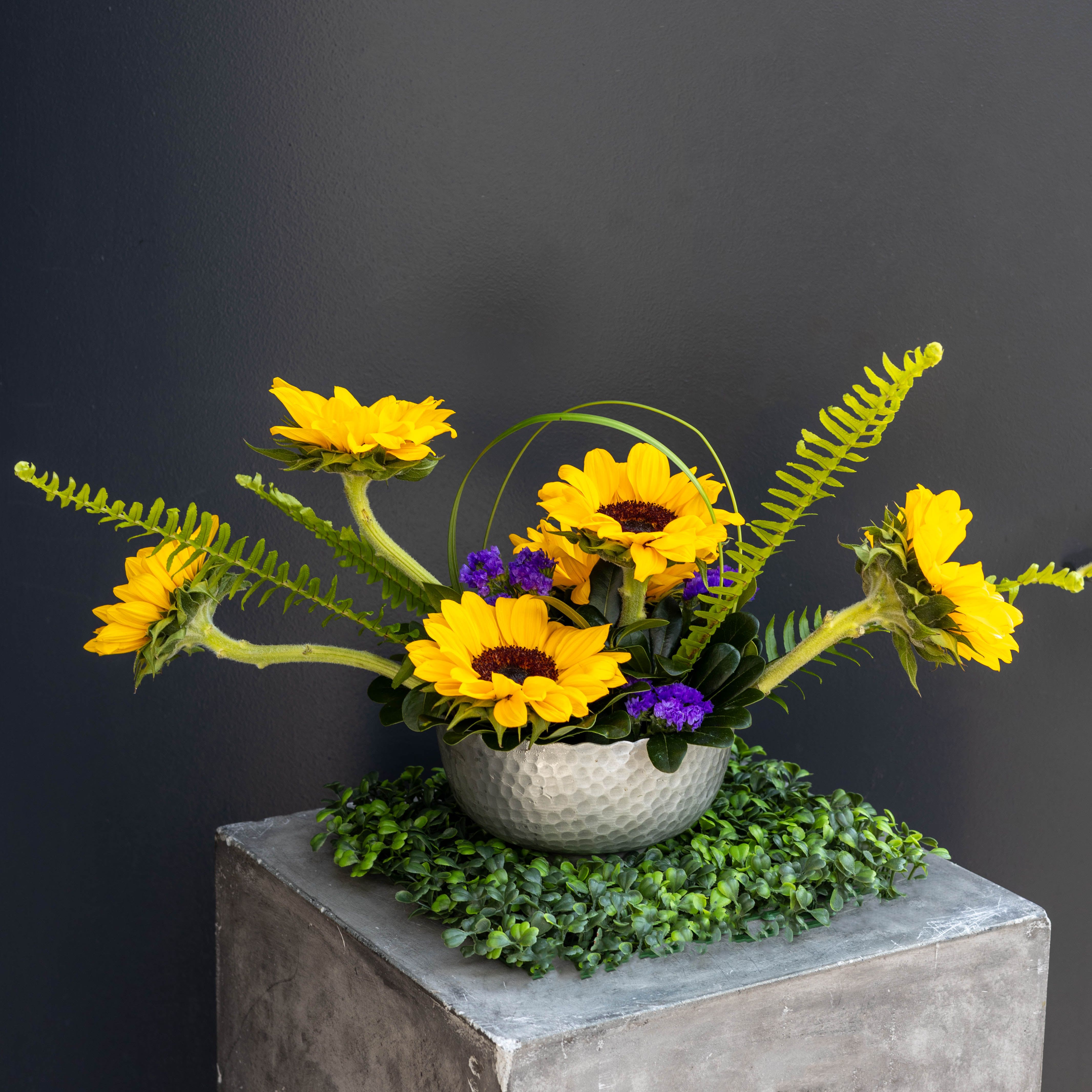 Hello Sunshine - This arrangement has such a bright, modern-meets-playful spring energy. The sunflower's sunny blooms and sculptural lines feel both joyful and artistic.