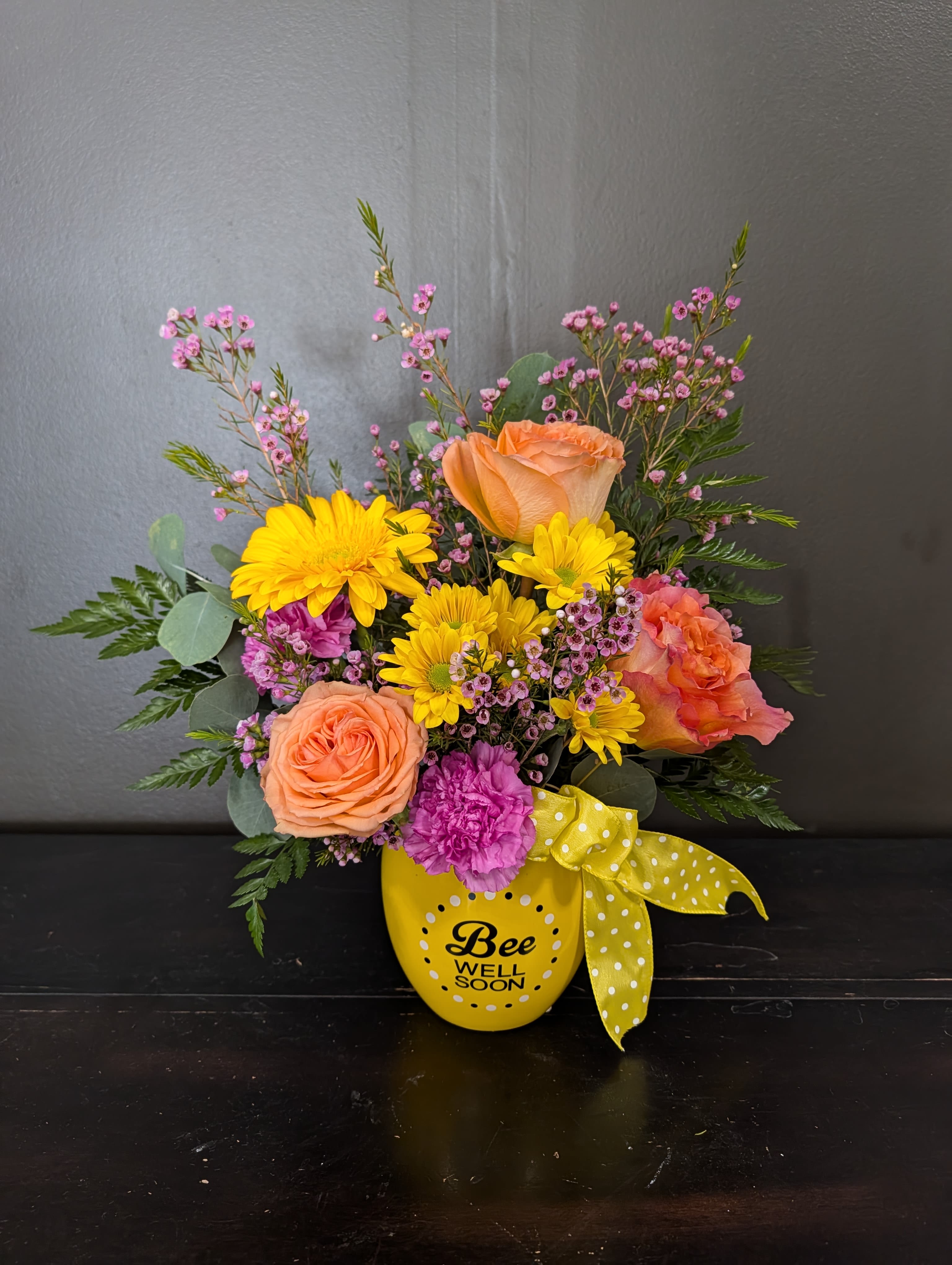 Bee Well Pot - A cheery pink yellow and orange arrangement in a bee planter keepsake.