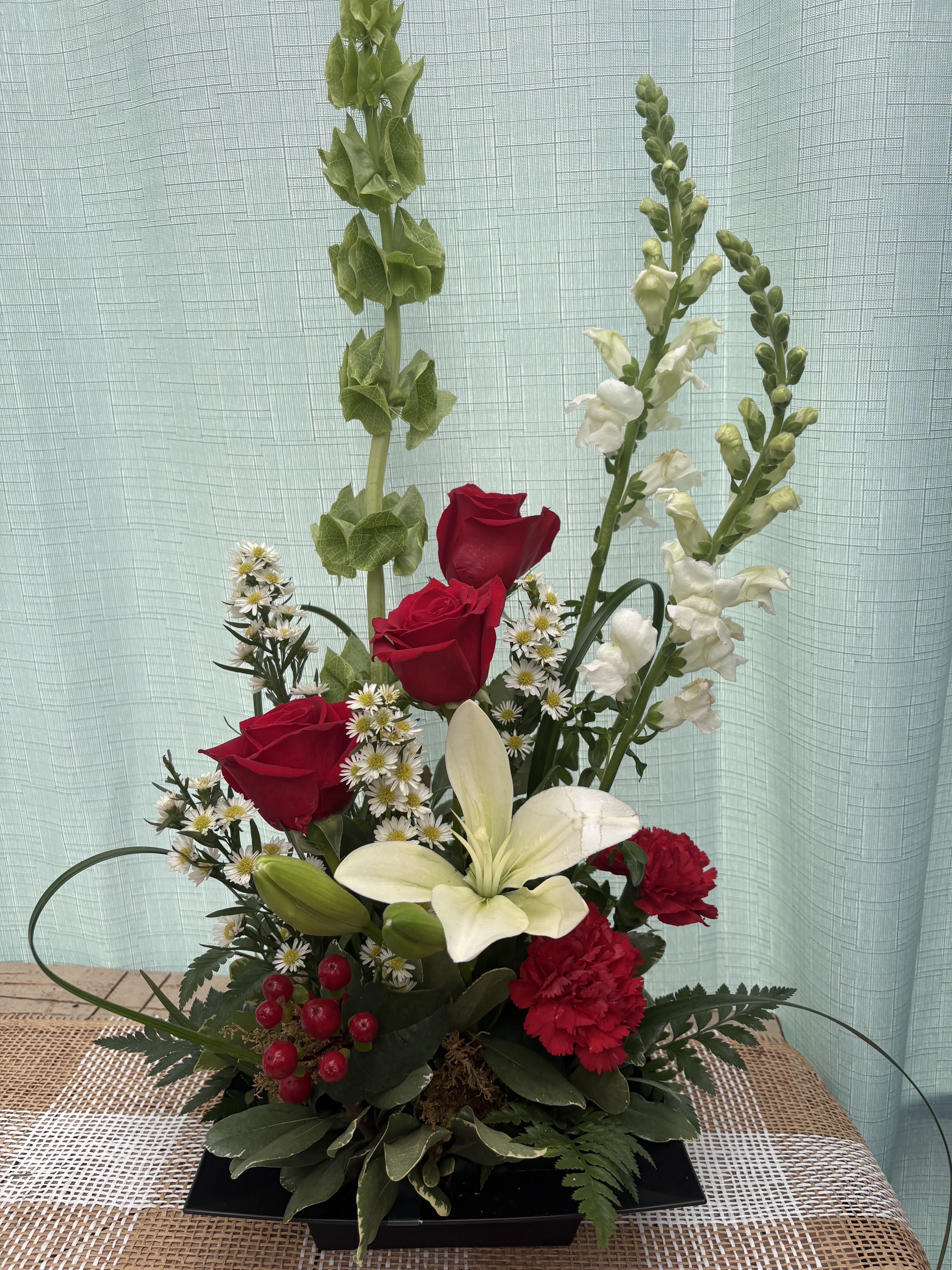 Ruby Red and White Arrangement - A beautiful arrangement with red roses and white lilies for a classy, elegant look