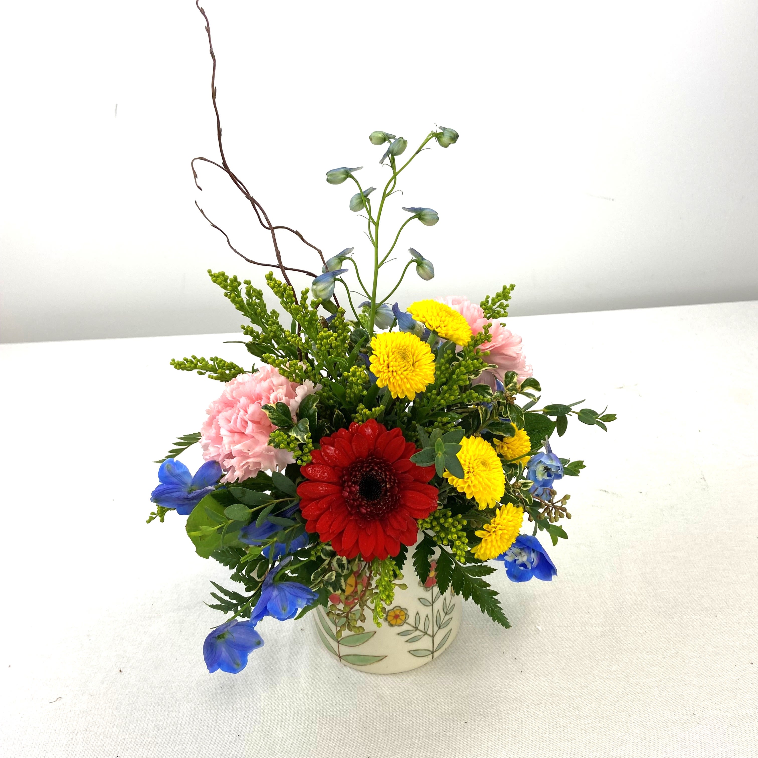 Mug of Blooms - A bright, cheerful Mug of Blooms that feels like a sunny hello - perfect as a birthday bouquet, a get-well pick-me-up, or a casual "thinking of you" gift. 