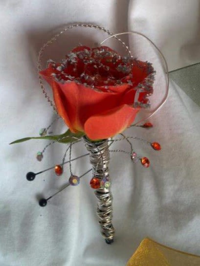 Red calla lily bouquet with decorative wire accents