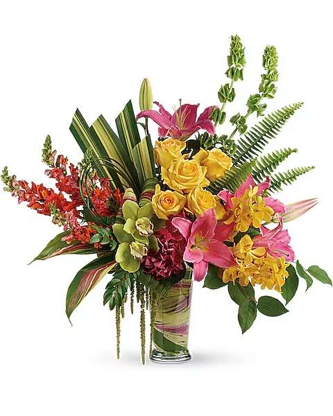 Pretty Paradise Bouquet - Take a tropical getaway, without ever leaving home! Inspired by the shades of a tropical sunset, this paradise of bright colors and rainforest textures is a dramatic experience for the senses! This pretty bouquet features dark pink hydrangea, green cymbidium orchids, yellow mokara orchids, yellow roses, hot pink oriental lilies, orange snapdragons, bells of Ireland, hanging green amaranthus, huckleberry, sword fern, hala leaves, ti leaves, bear grass, and lemon leaf. Delivered in a clear glass vase. A minimum of 5 days in advance is required to secure this item .