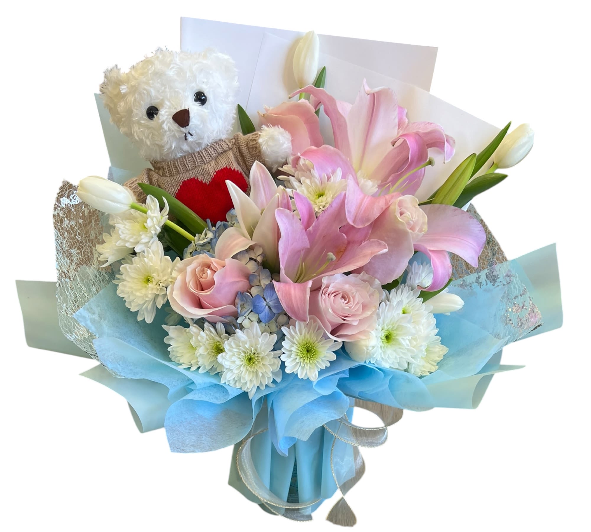 Sweetheart Teddy Bloom - A charming bouquet featuring soft pink lilies, roses, and delicate white blooms, paired with an adorable teddy bear. Perfect for expressing love, comfort, and warmth in one heartfelt gift.