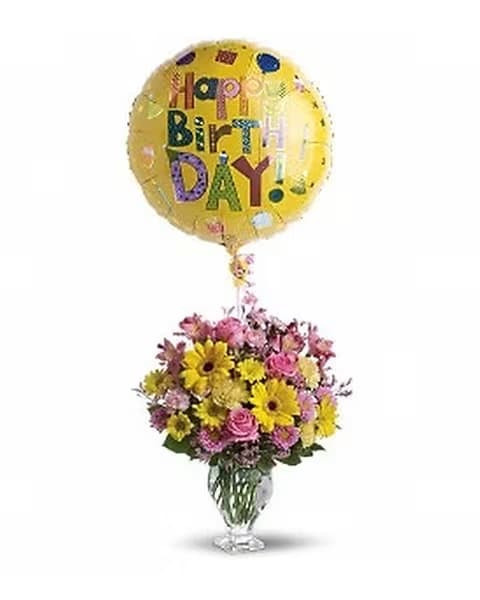 Dazzling Day Bouquet - Pure pretty! This classic floral design puts a romantic spin on your birthday wishes in soft shades of pink and yellow. Presented in an antique-style vase, the traditional bouquet is finished with a fun mylar balloon. Vase subject to availability and will be replaced with similar if unavailable.