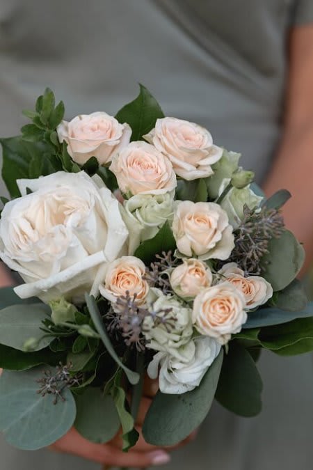 Bouquet of pale pink and white roses with eucalyptus