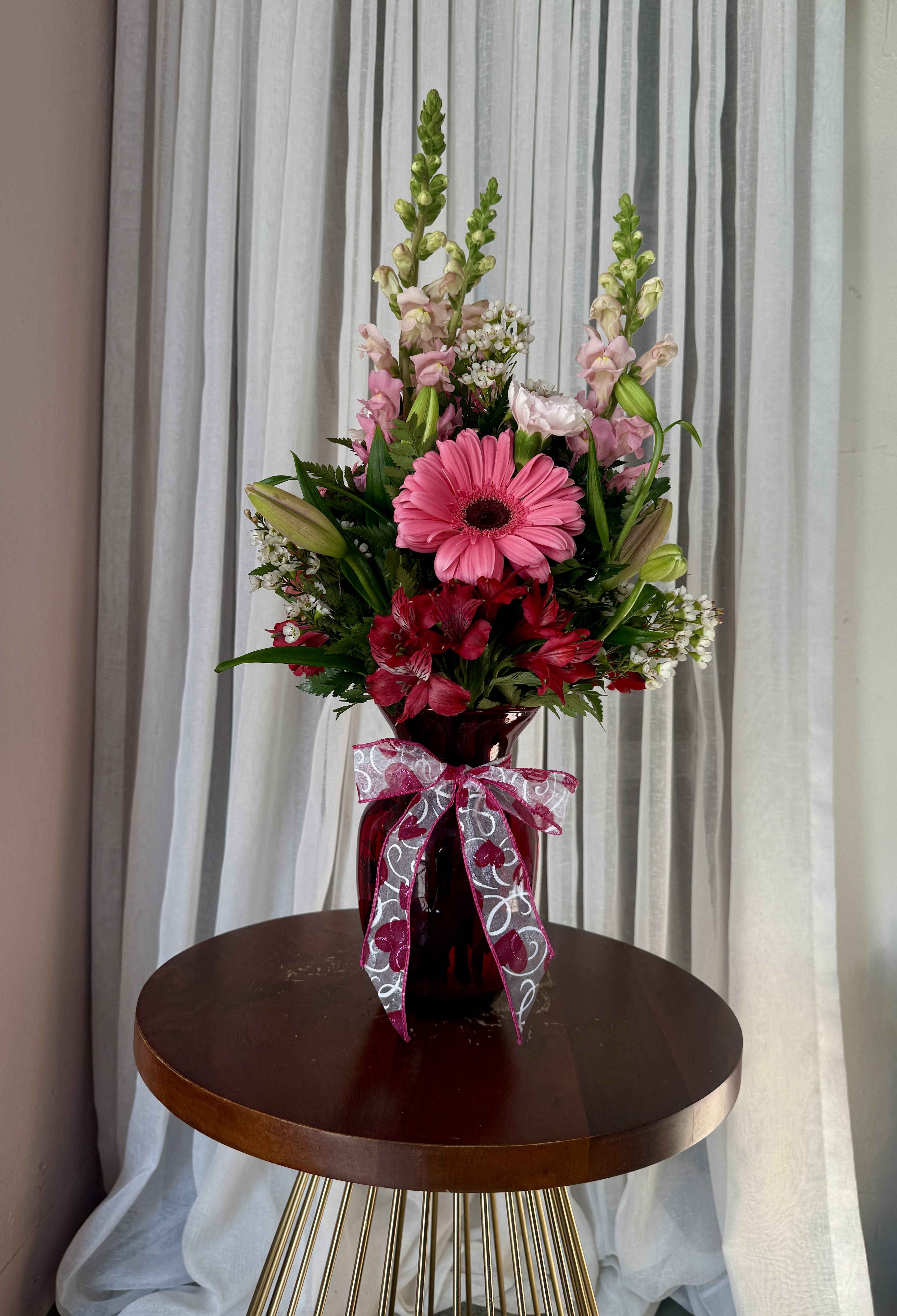 Valentine's Day - Petite Arrangement - Variety of blooms including roses, gerbera daisies, lilies and greens.