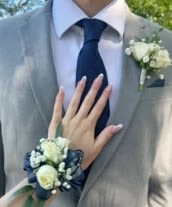 White and Navy Prom Combo(s) - This Prom Combo allows you to customize your flower options Standard - Boutonniere and Wrist Corsage Deluxe - Boutonniere and Wrist Corsage with BLING! Premium - Boutonniere, Wrist Corsage AND Bouquet with Bling