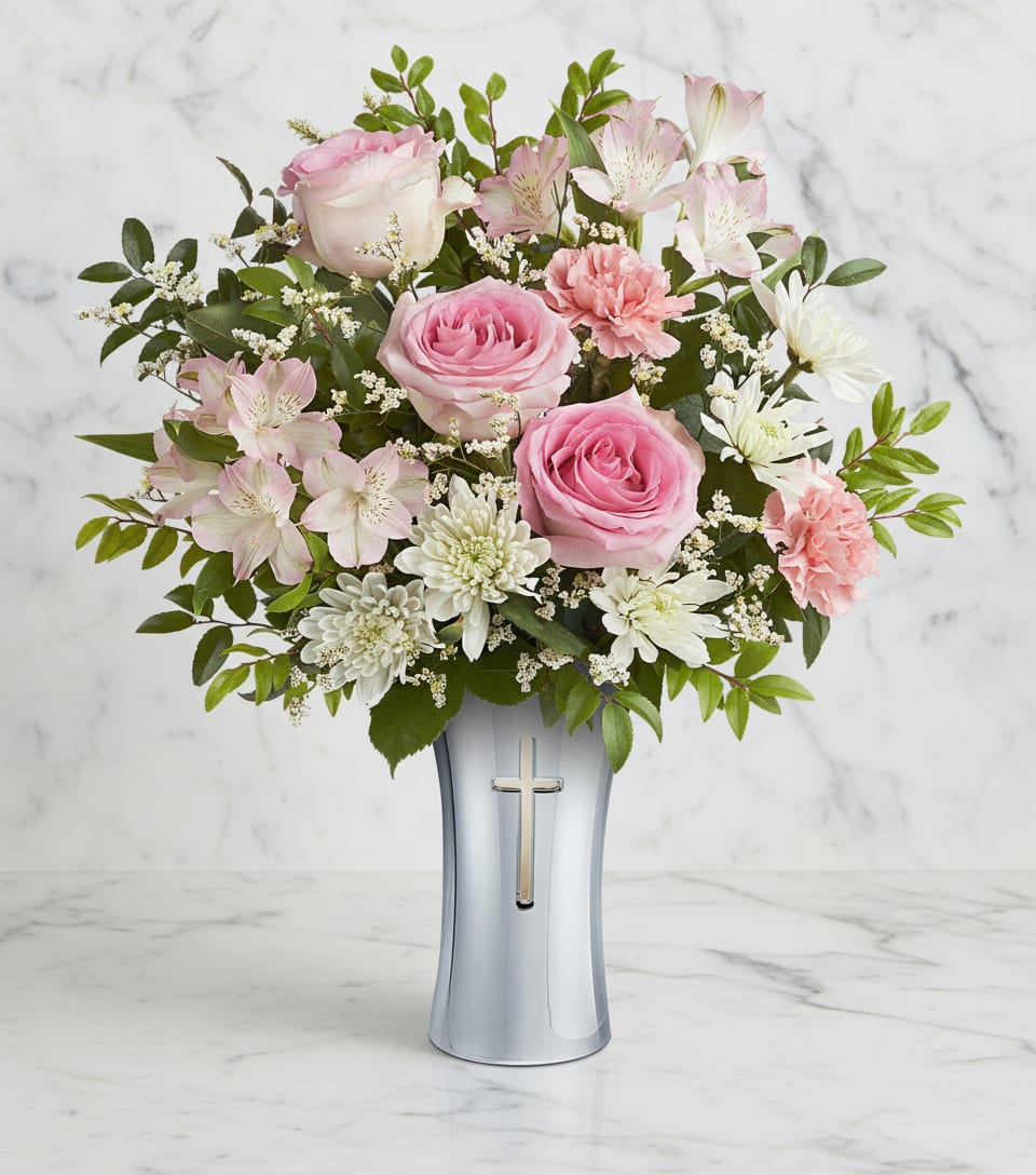 Loving Whisper Bouquet - Soft and serene, this graceful bouquet of delicate pink and white blooms is a heartfelt expression of love and peace. Presented in Shining Cross Vase, a timeless silver-finished keepsake with an elegant cross cutout, this uplifting arrangement offers comfort and faith for years to come.