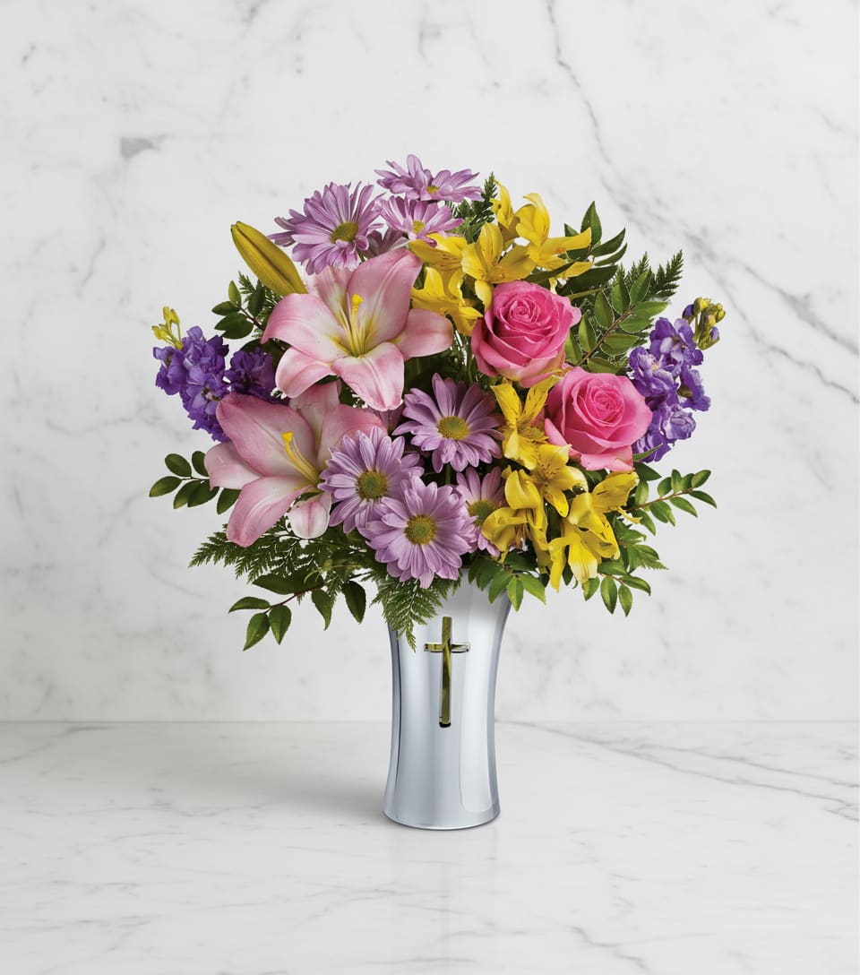 Bright Life Bouquet - Show them how much you care with this beautifully bright yet reverent arrangement of roses, lilies and alstroemeria. Gracefully presented in a shining, silver-finished ceramic vase with cross cut-out - a touching tribute to a bright life.