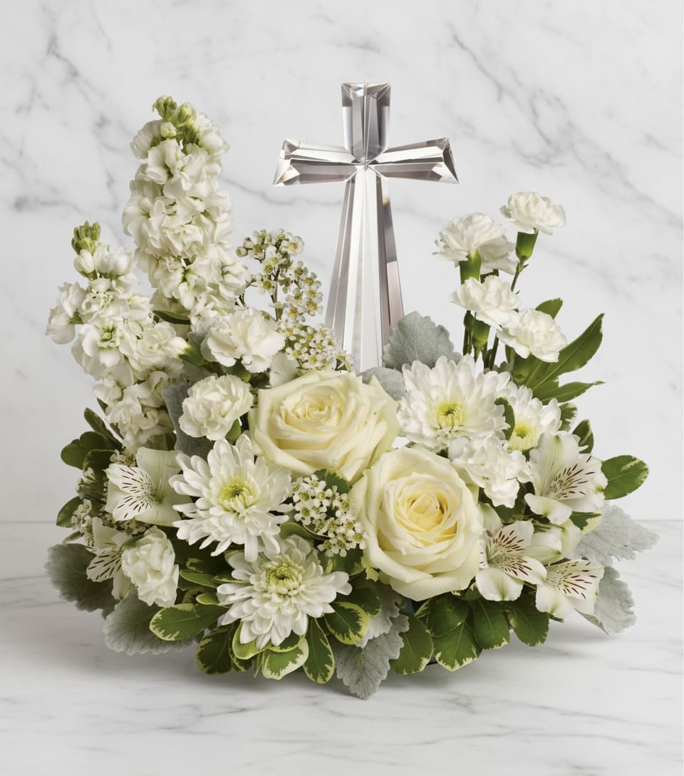 Divine Peace Bouquet - An elegant display of faith and divine peace, this beautiful arrangement will comfort the bereaved in a truly thoughtful and respectful way. An exquisite crystal cross is surrounded by a bed of lovely blossoms. It is sure to be appreciated and always remembered.