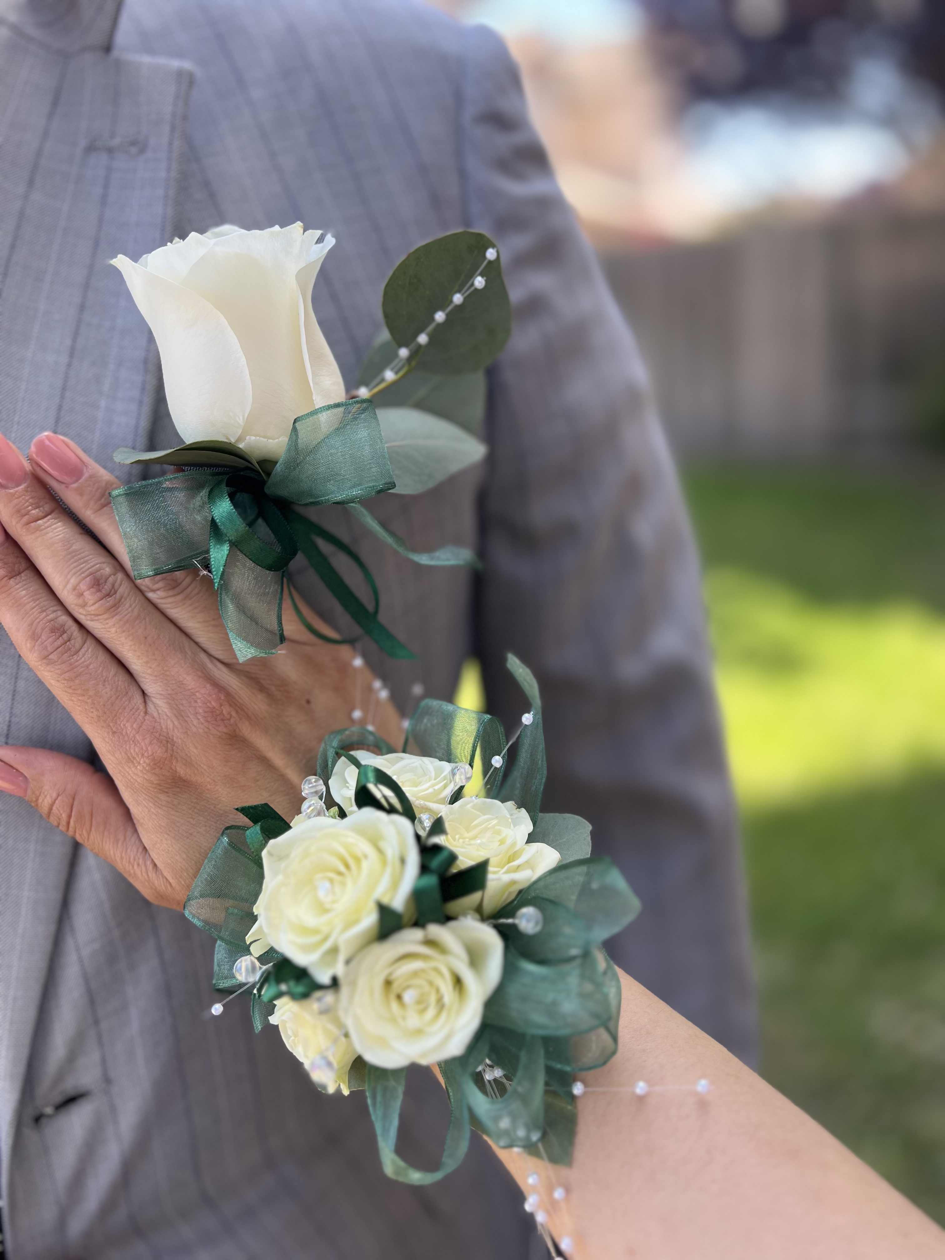 Green Corsage and Boutonniere  - Elegant Graduation Accessory. Celebrate graduation in style with this beautifully coordinated green corsage and boutonniere Set. this Fresh and vibrant set adds a touch of elegance to your milestone moment. Order now 