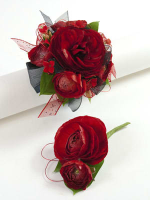 Red floral boutonniere and matching wrist corsage with ribbon accents