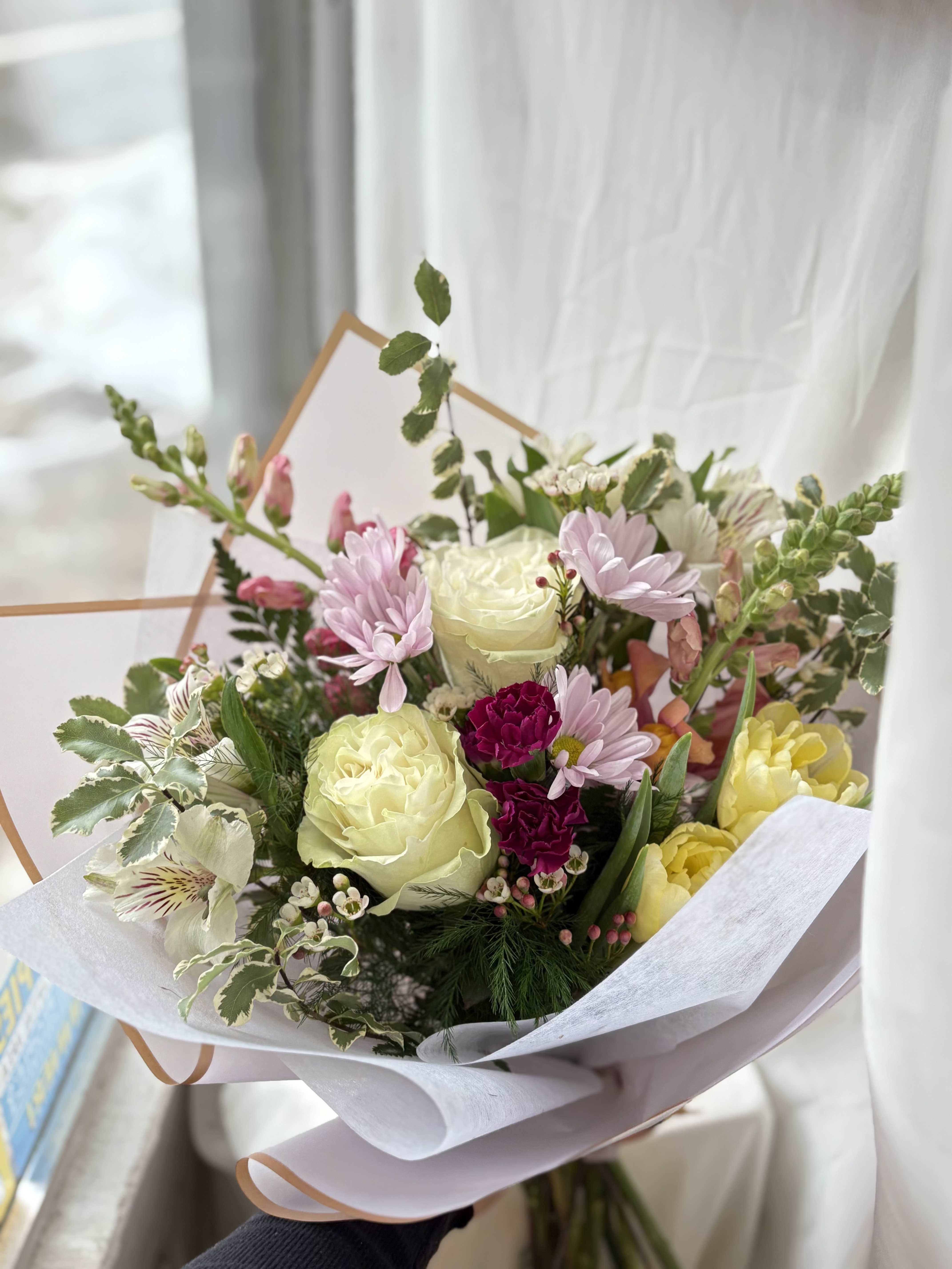 Designer's Choice Wrapped Bouquet - A colorful selection of our freshest seasonal blooms, wrapped presentation style! We cannot guarantee the same colors and varieties of flowers pictured, but it will give the same style and feel!  Let us know if there are any specific colors or varieties of flowers you have in mind, we will try our best to accommodate!