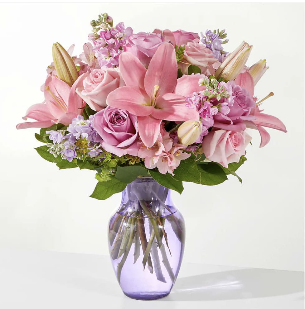 The Crown Jewel Bouquet  - PINK. ROSE, STOCK AND LILIES IN A LAVENDER VASE.  MOTHER'S DAY ONLY!  (MAY 6-10)
