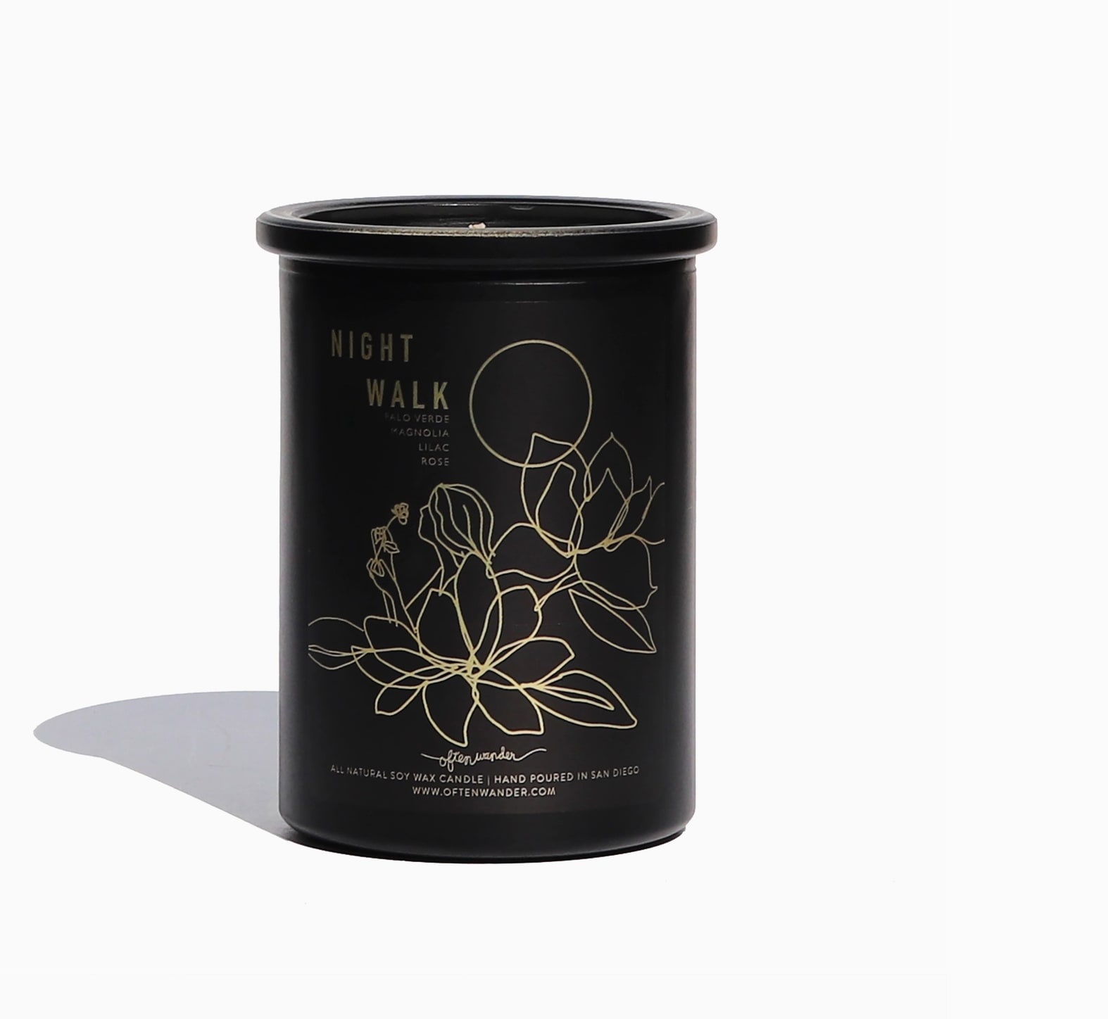 Black candle jar with gold floral line art and Night Walk label