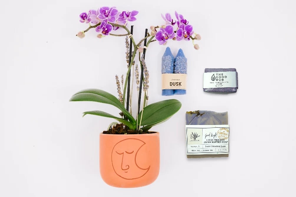 Lunar Light Gift Set - LUNAR LIGHT GIFT SET  Sol Ambiance is proud to support these artists and makers, and other small businesses, to make our community and the world a better place. Enjoy your gift set!  Mini Phalaenopsis Orchid planted in Accent Decor's clay luna pot.  Lit Rituals ‘Dusk’ Beeswax Altar Candles. These gorgeous blue candles are dyed with Indigo, and due to the nature of the tiny blue flowers, no two batches are ever the same shade.  Topped with himalayan salt, you can burn these unscented candles when you need a dose of purifying energy in your home.  Sage Creative Labs "Good Night" Soap. Get an excellent night sleep after a soothing shower using this organic olive oil based soap. Tops with dried lavender buds and chamomile flowers, your skin will be relaxed and hydrated before a good night's sleep.  The Good Rub Lavender Bath Bomb- These herbal-infused bath bombs allow you to experience the ultimate relaxation with natural and organic ingredients. Lavender has many benefits including its ability to disinfect the skin, promote healthy blood circulation and relieve tension. Combine that with freshly dried lavender buds and you have yourself a sweet, rich aromatherapy experience. The colorants are earth based and scents are straight from plants.