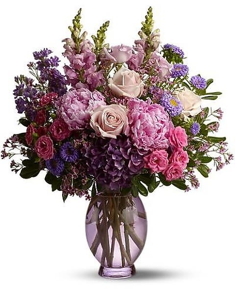 Springtime Serenade - Celebrating a springtime anniversary, birthday or graduation? Send Teleflora’s Springtime Serenade flower bouquet, and create an impression! This beautiful burst of blossoms features over two feet of fresh flowers such as peonies, roses and more in lush shades of pink, purple and lavender. Go ahead, splurge this year – and make someone feel like a star! 