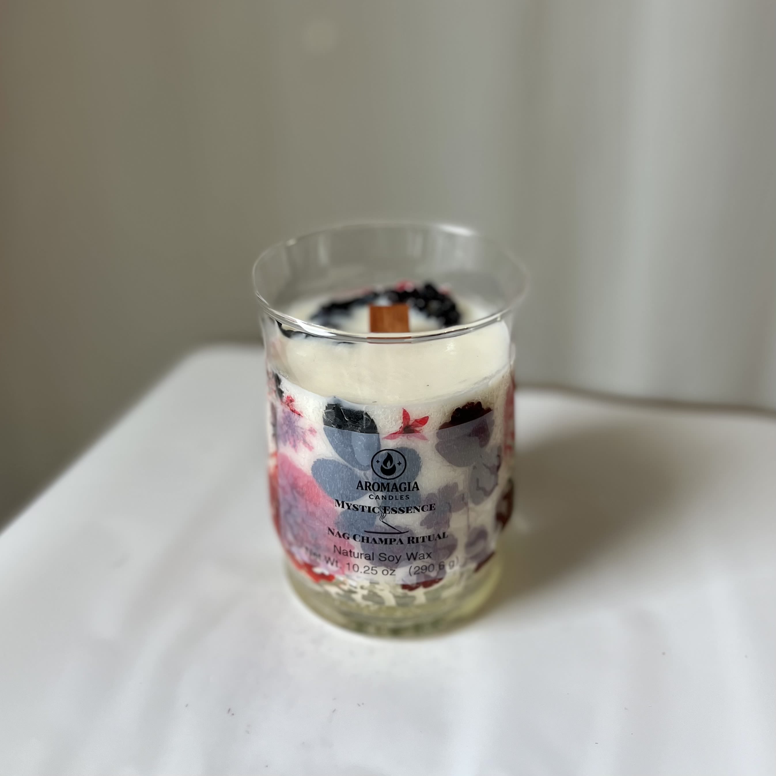 Nag Champa Candle (10.25 oz) Locally Made - This Mystic Essence candle has a perfect scent for cleansing the home! Locally handmade in Durham! Aromagia© READ: This is an add-on product and can only be purchased alongside a flower arrangement or plant. Do not purchase by itself- you will not be refunded!