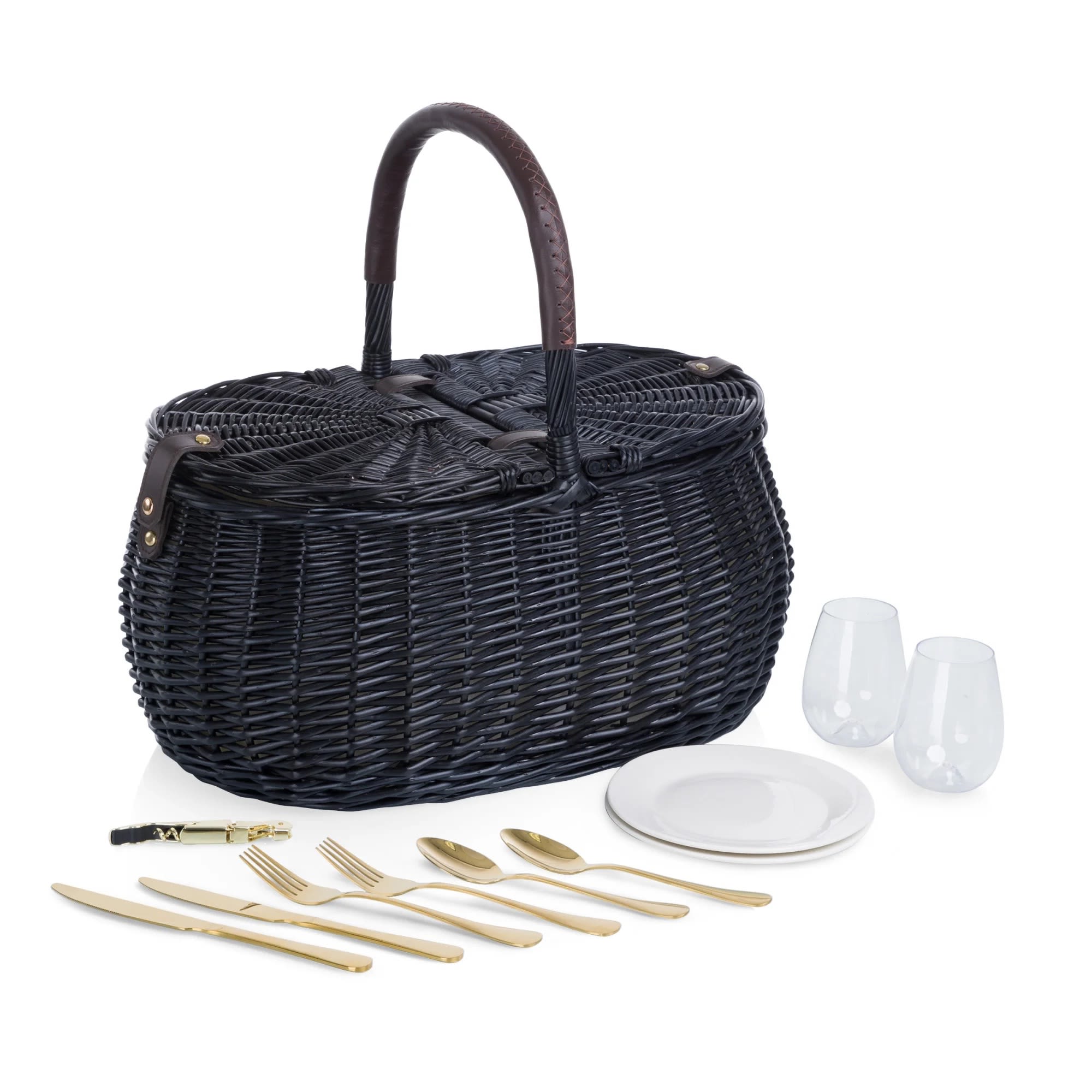 Black wicker picnic basket with plates, glasses, and gold utensils
