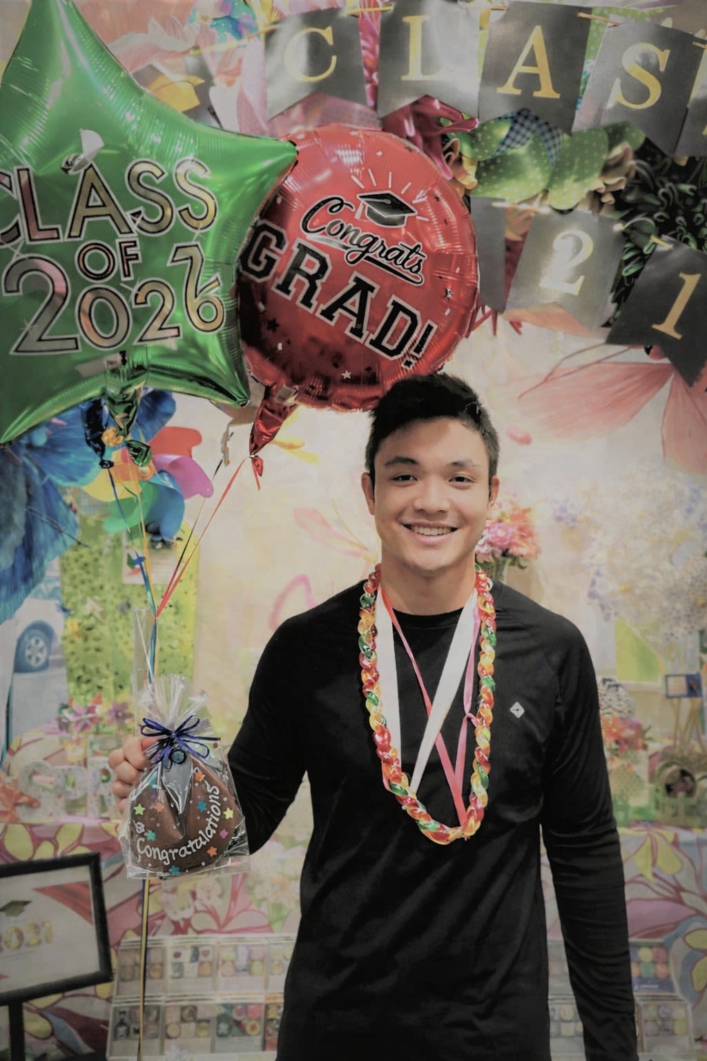 Class of 2026 Foodie Graduation Package  - This super fun package is perfect for someone that loves food, or just can't have floral lei!  Consists of our immensely popular Li Hing Gummy Lei, Exclusive Hawaiian Paradise Candies Giant Fortune Cookie Lei, and 3 mylar balloons.  So Cool!!!