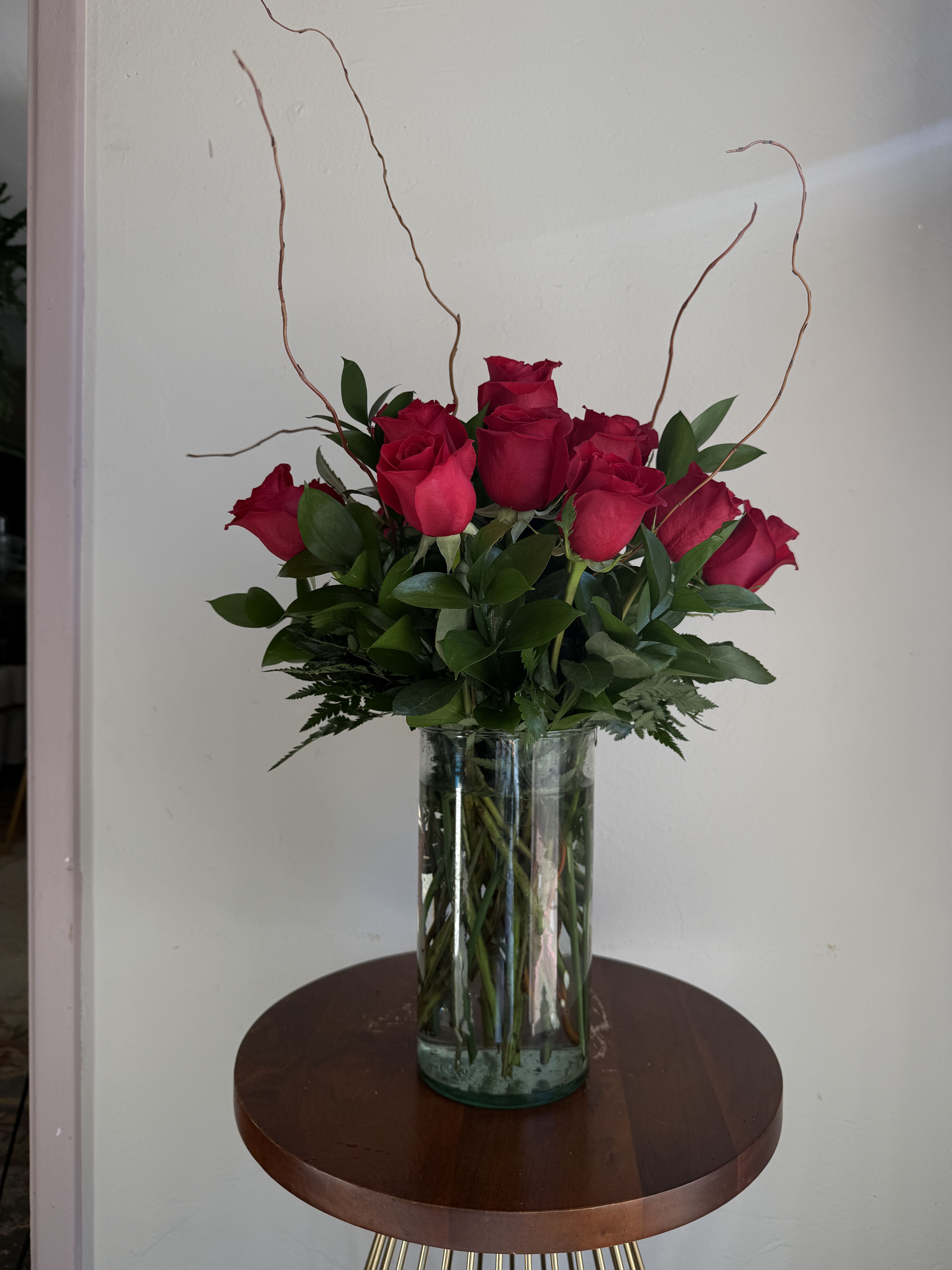 Bouquet of red roses in a clear glass vase