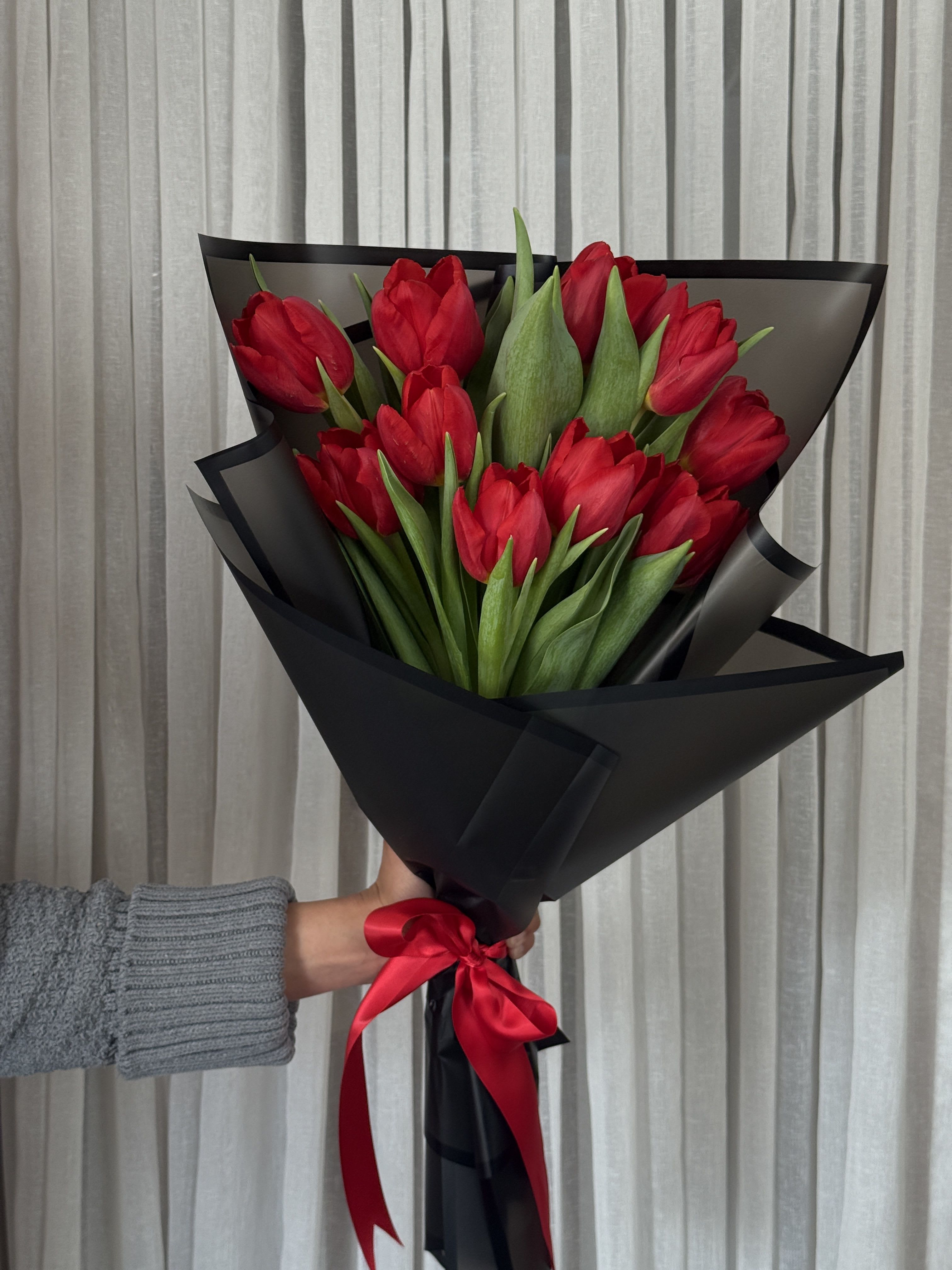 Red Tulips - 10 red tulips carefully wrapped and tied with a satin ribbon  Please request color of wrapp and ribbon in the notes.