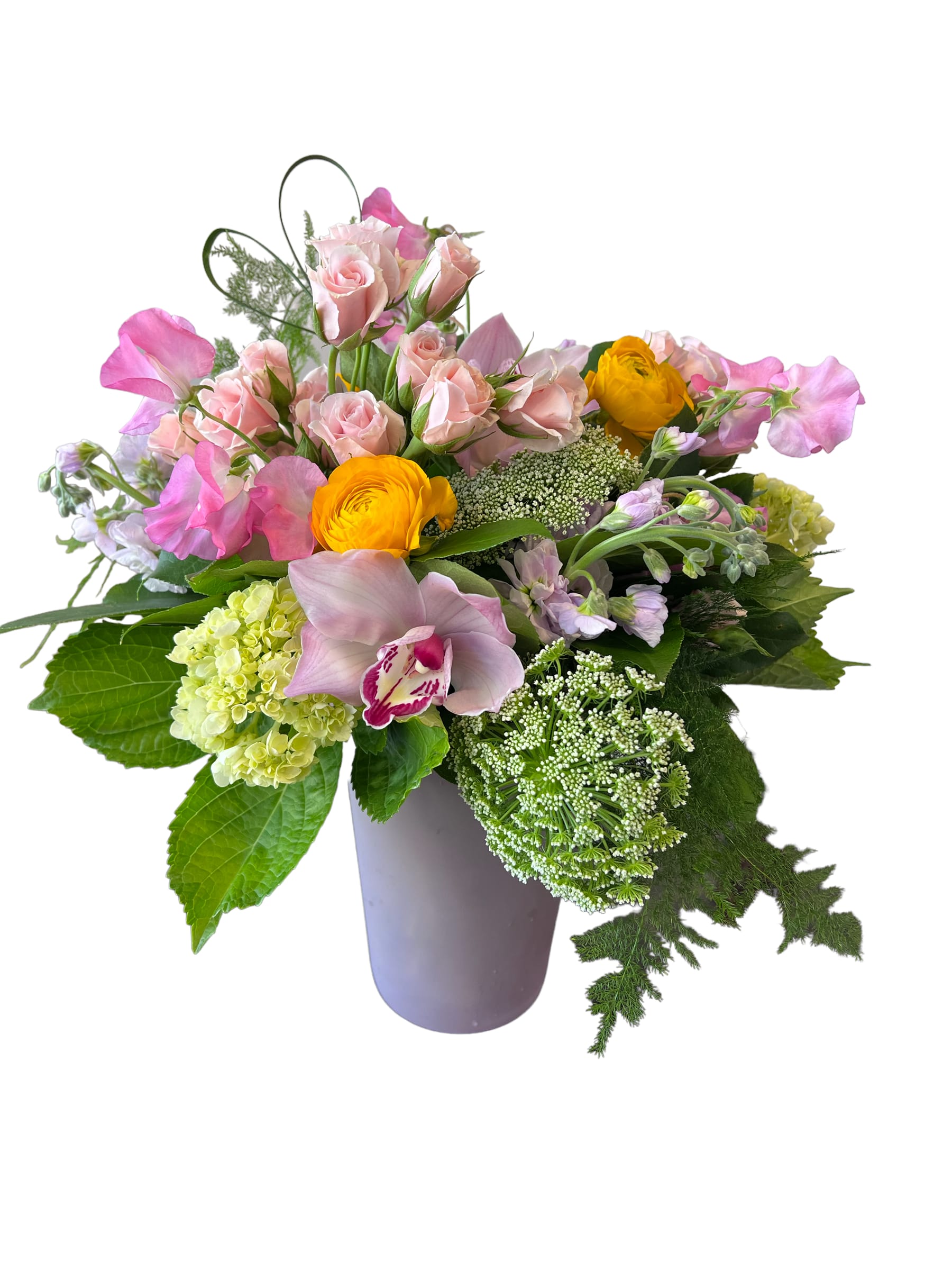 Pink roses and yellow ranunculus in a lavender vase