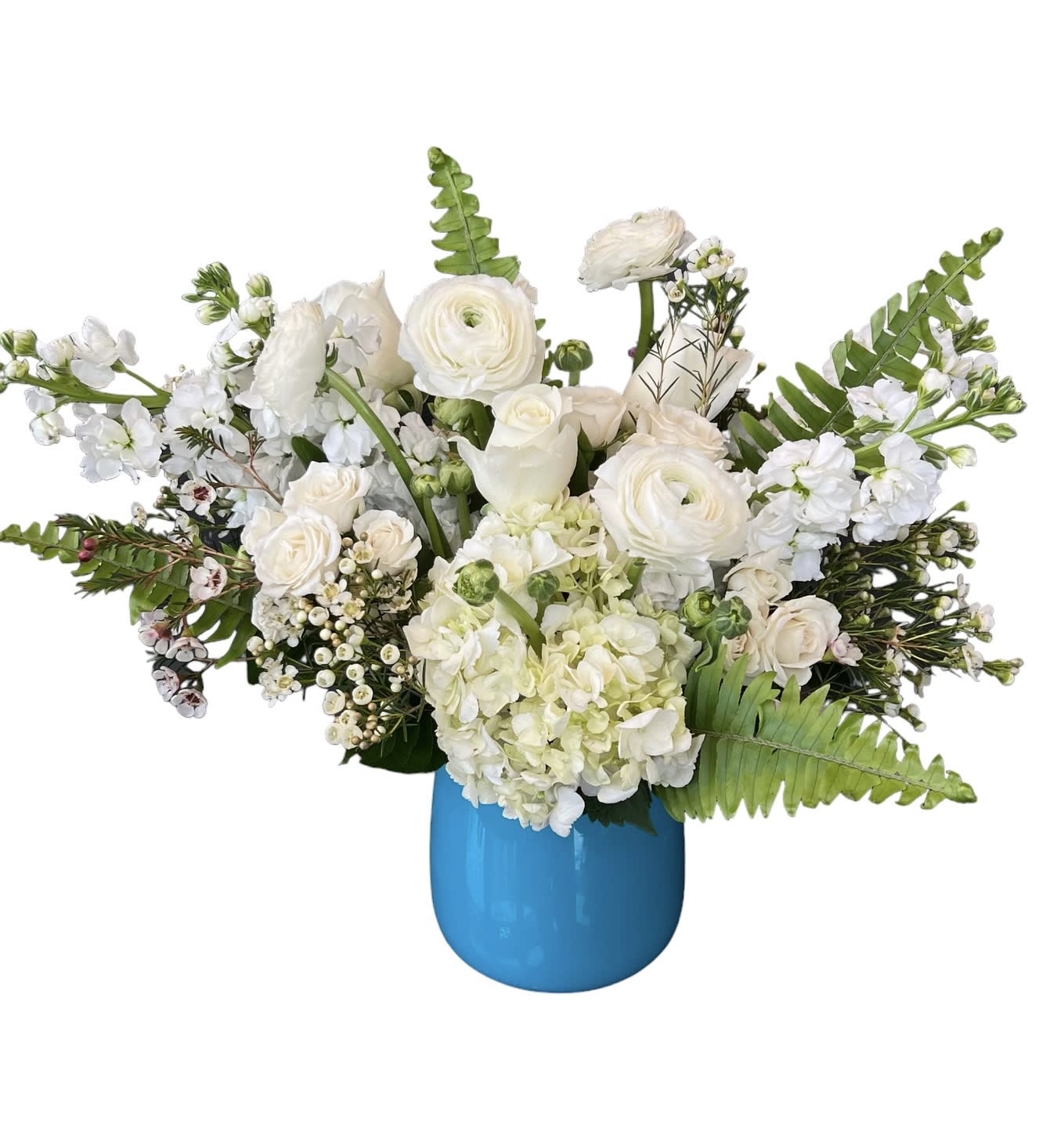 White floral arrangement in a bright blue vase