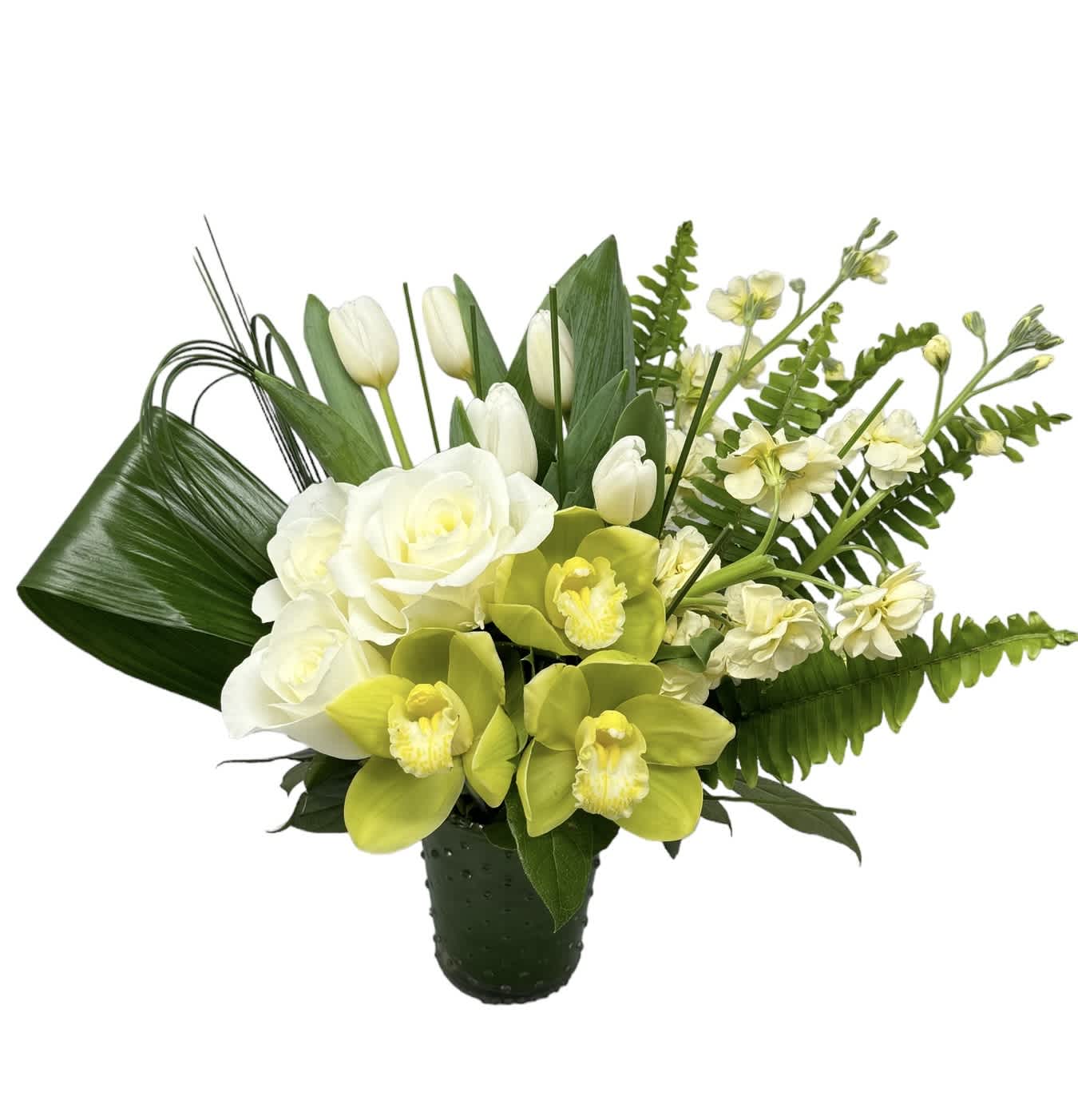 White roses, tulips, and green orchids in a dark vase