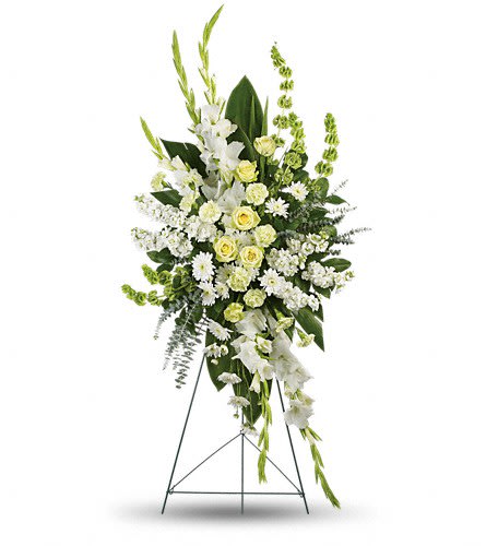 Tall white and pale yellow floral standing spray on an easel