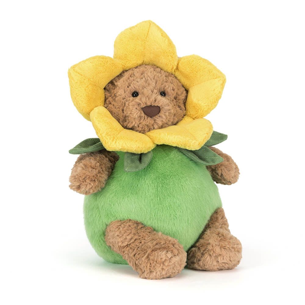 Plush teddy bear dressed as a yellow flower