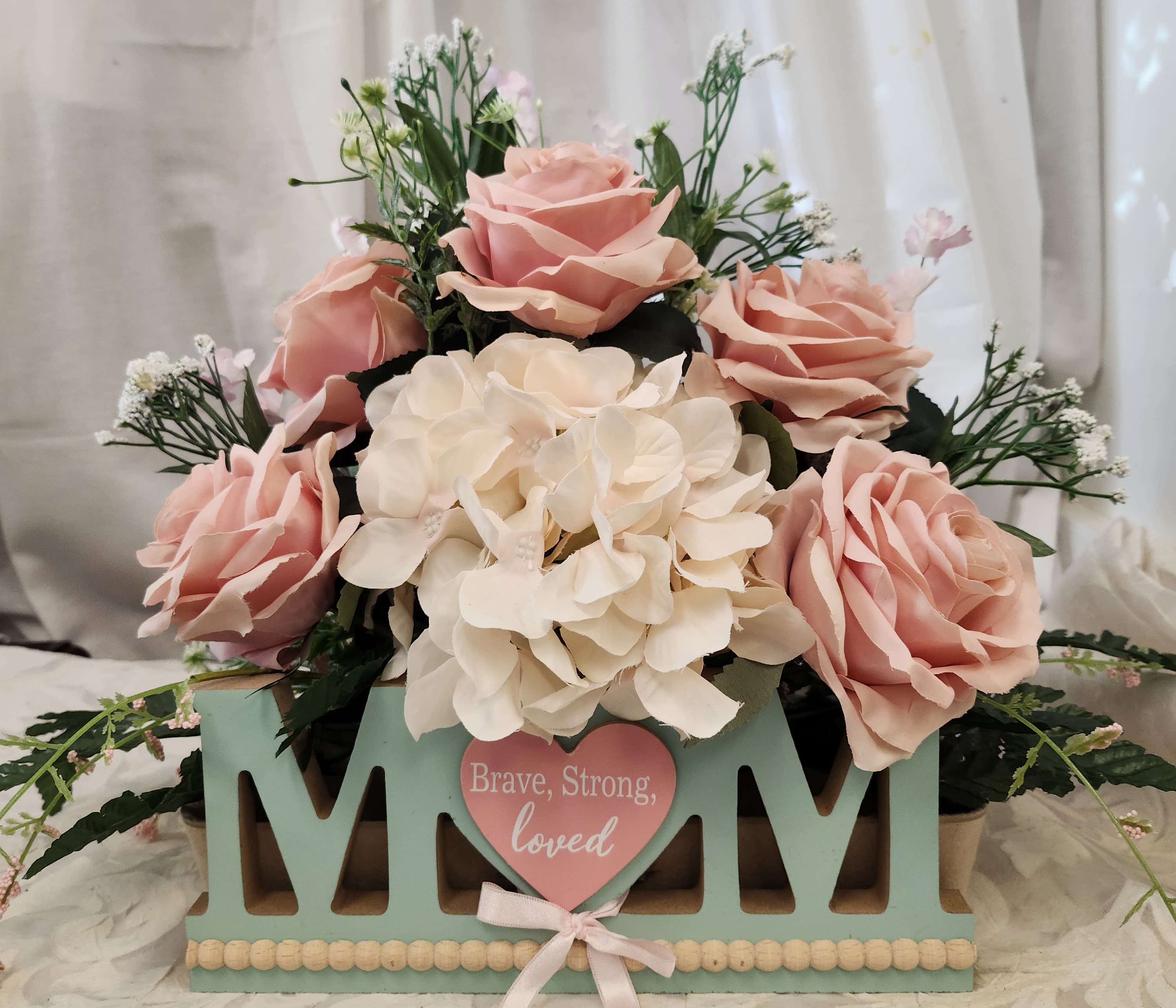 Brave Mom - Soft pink roses nestle against a generous cluster of creamy white hydrangeas in this heartfelt flower arrangement, making it an ideal Mother's Day bouquet or birthday gift to say "thank you" to a brave mom. The pastel palette of pinks, whites and soft greens creates a gentle, sentimental look that reads as both everyday affection and a special, celebratory gesture for the person you're thinking of. Can be made in fresh flowers at an additional cost.