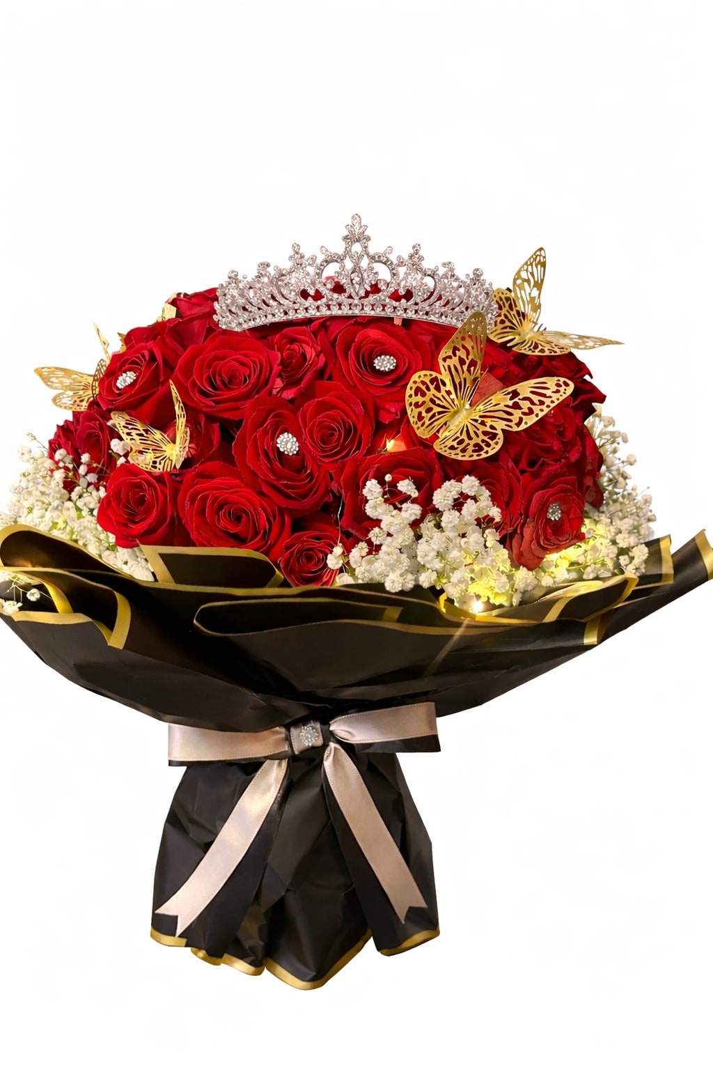 Royal Desire - A breathtaking statement of passion and luxury. This exclusive arrangement of 100 premium red roses is designed to captivate, adorned with delicate golden butterflies, soft glowing lights, and crowned with an elegant tiara.  Wrapped in sophisticated black and gold, Royal Desire is more than flowers — it’s a symbol of love, power, and unforgettable beauty. 